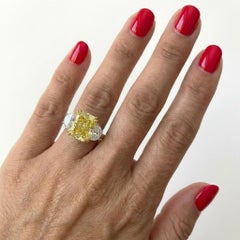 GIA Certified 3.05 Carat Fancy Yellow Diamond Three-Stone Ring, I Flawless