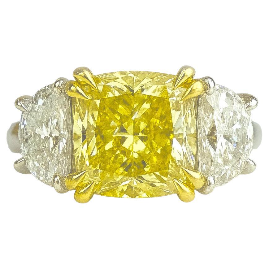 GIA Certified 3.05 Carat Fancy Yellow Diamond Three-Stone Ring, I Flawless