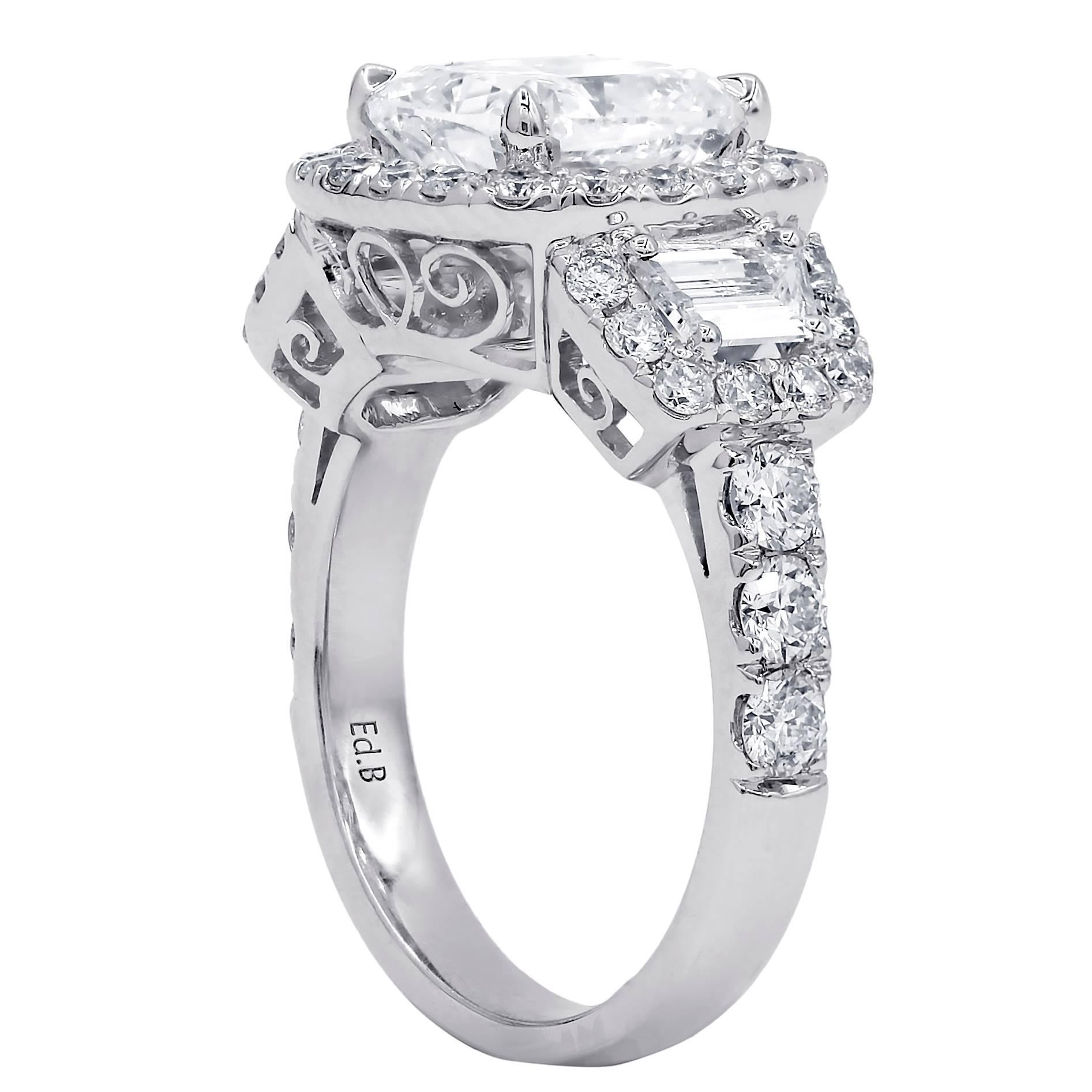 18kt white gold engagement ring with GIA certified 3.02 H-SI2 cushion cut diamond set with two trapezoids diamonds into halo like setting, feature 1.70ct