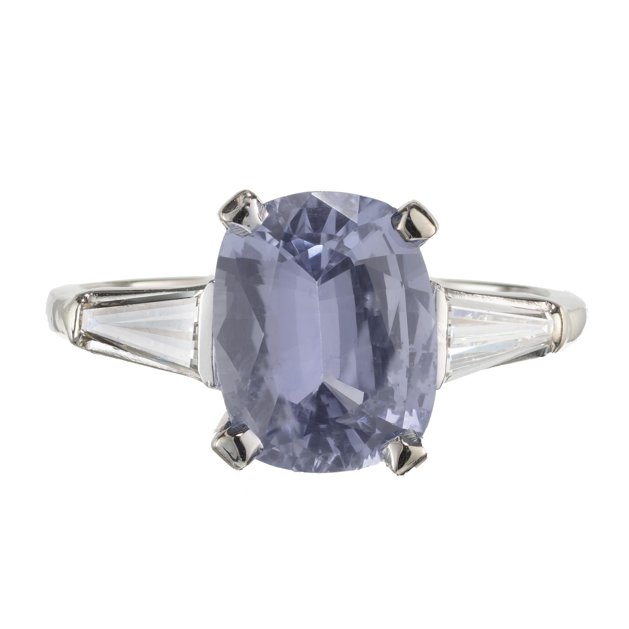 Late Art Deco Light to medium bright Ceylon blue oval 3.06ct cushion Sapphire and diamond three-stone engagement ring. Oval sapphire center stone, with two tapered baguette side diamonds in a platinum setting.  GIA certified. 

1 natural 3.06ct oval