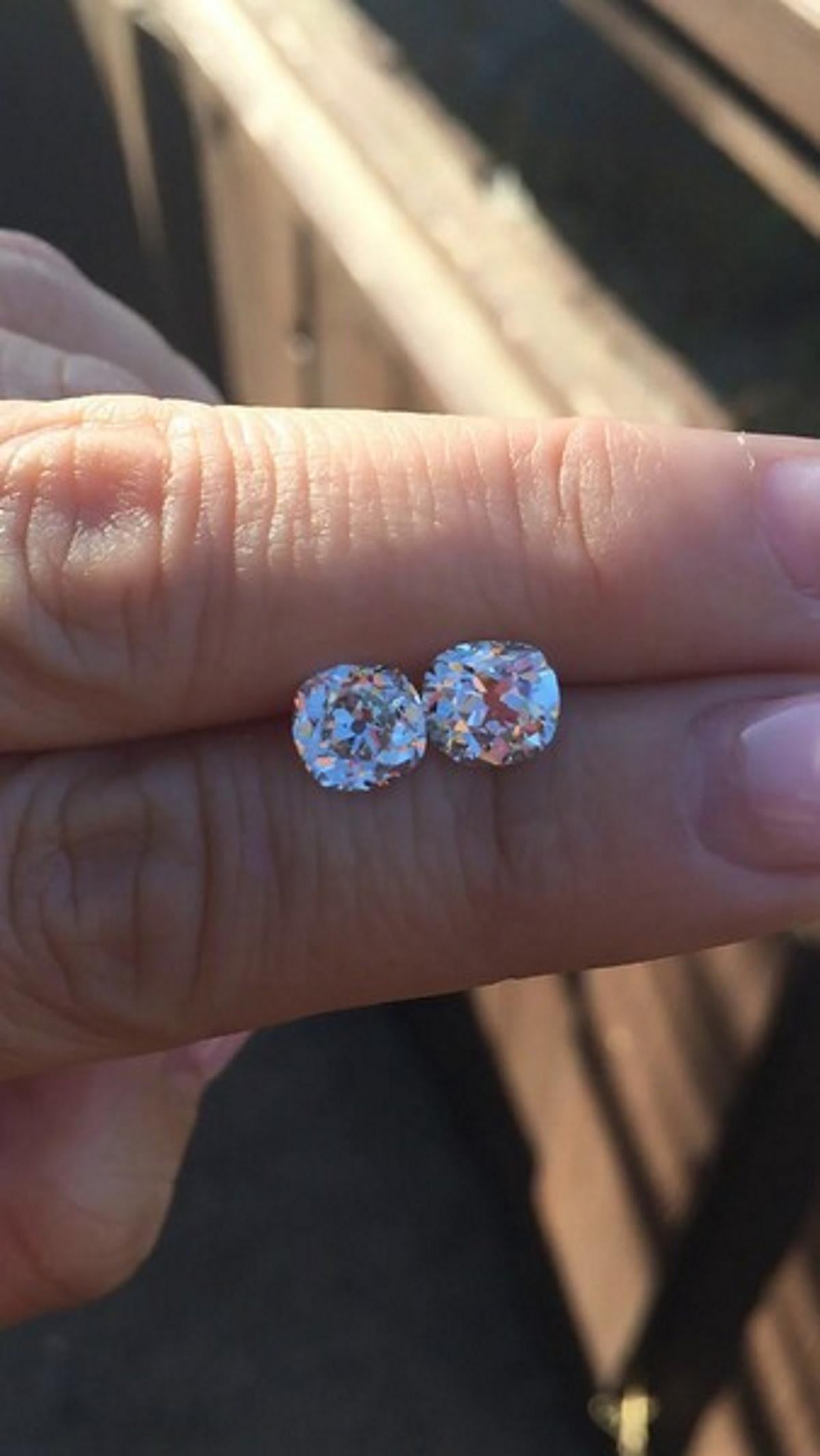 This gorgeous and rare 2.01ctw antique matched pair of old mine cut diamonds is bright white, eye clean, full of old world charm, and dazzling with phenomenal sparkle! Cut by hand over a century in the past during the Victorian era, these rare