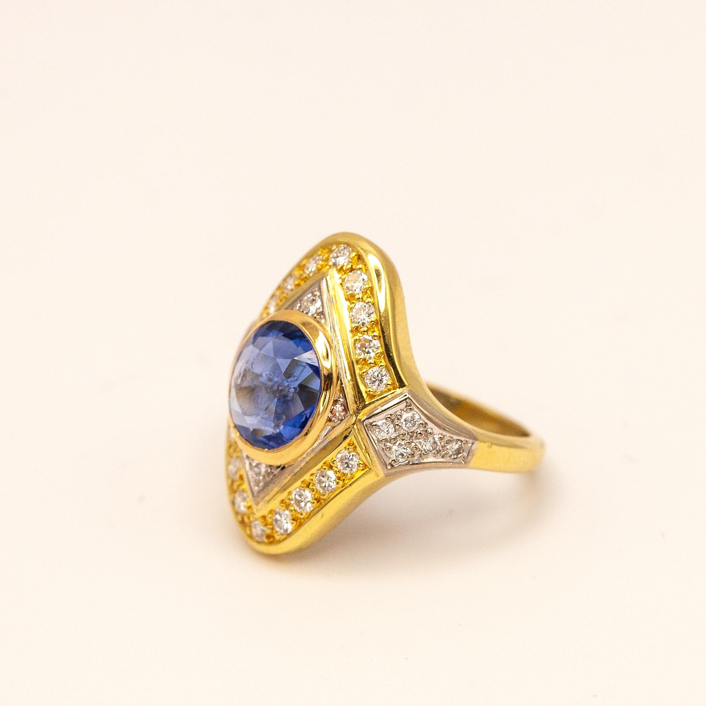 18K yellow gold and white gold diamond natural sapphire ring set with a GIA certified 3.06 carats No-heated Burma (Myanmar) blue sapphire and 32 brilliant cut diamonds approximate 0.60 carats F-G color VVS-VS clarity

Ring size: 5.75

Approximate