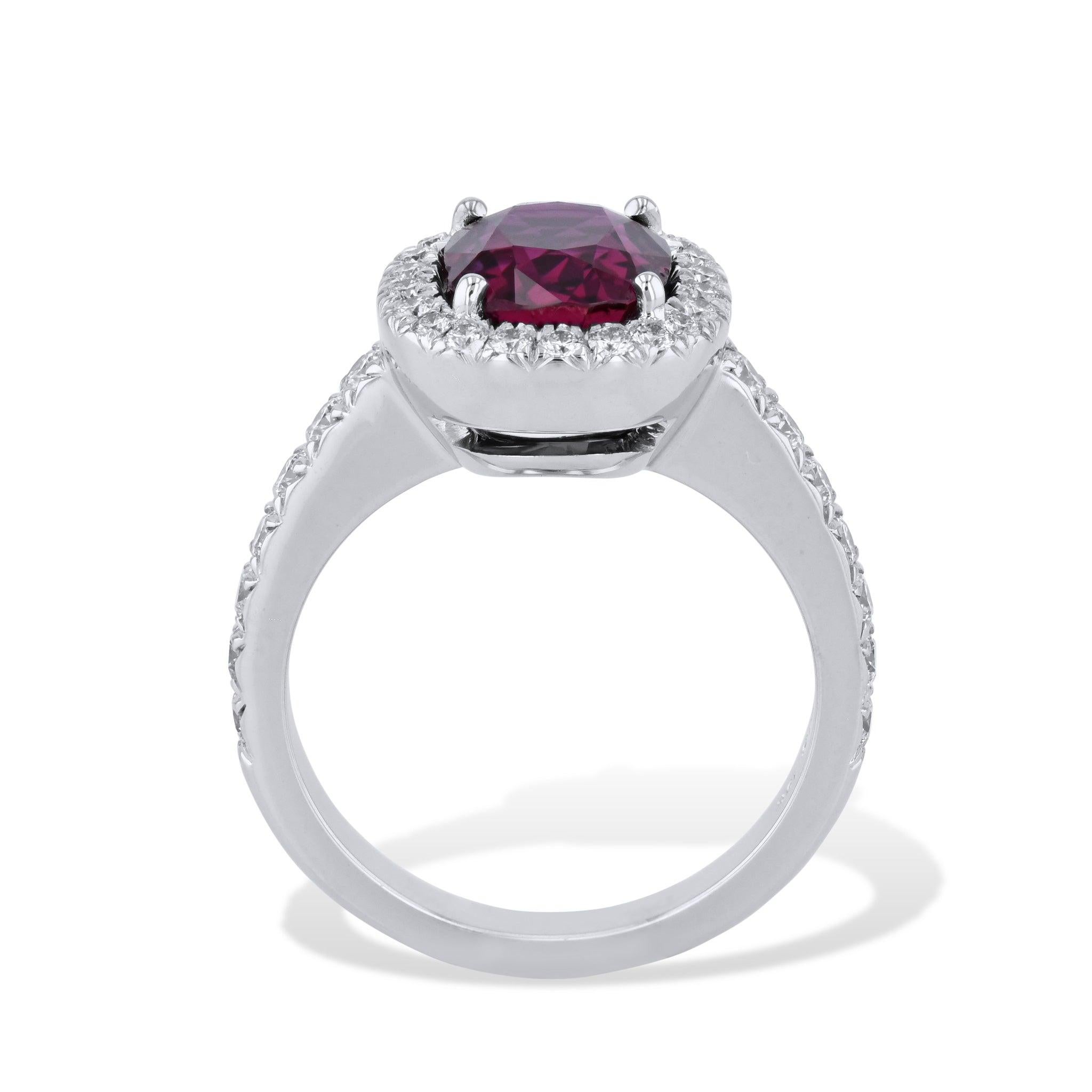 This luxurious Oval Ruby Pave Diamond White Gold Ring is handcrafted from 18 karat white gold. It  features a breathtaking 3.07 carat oval ruby at its center. There is an additional 36 pieces of 0.63 total carats of diamond pave that surrounds the