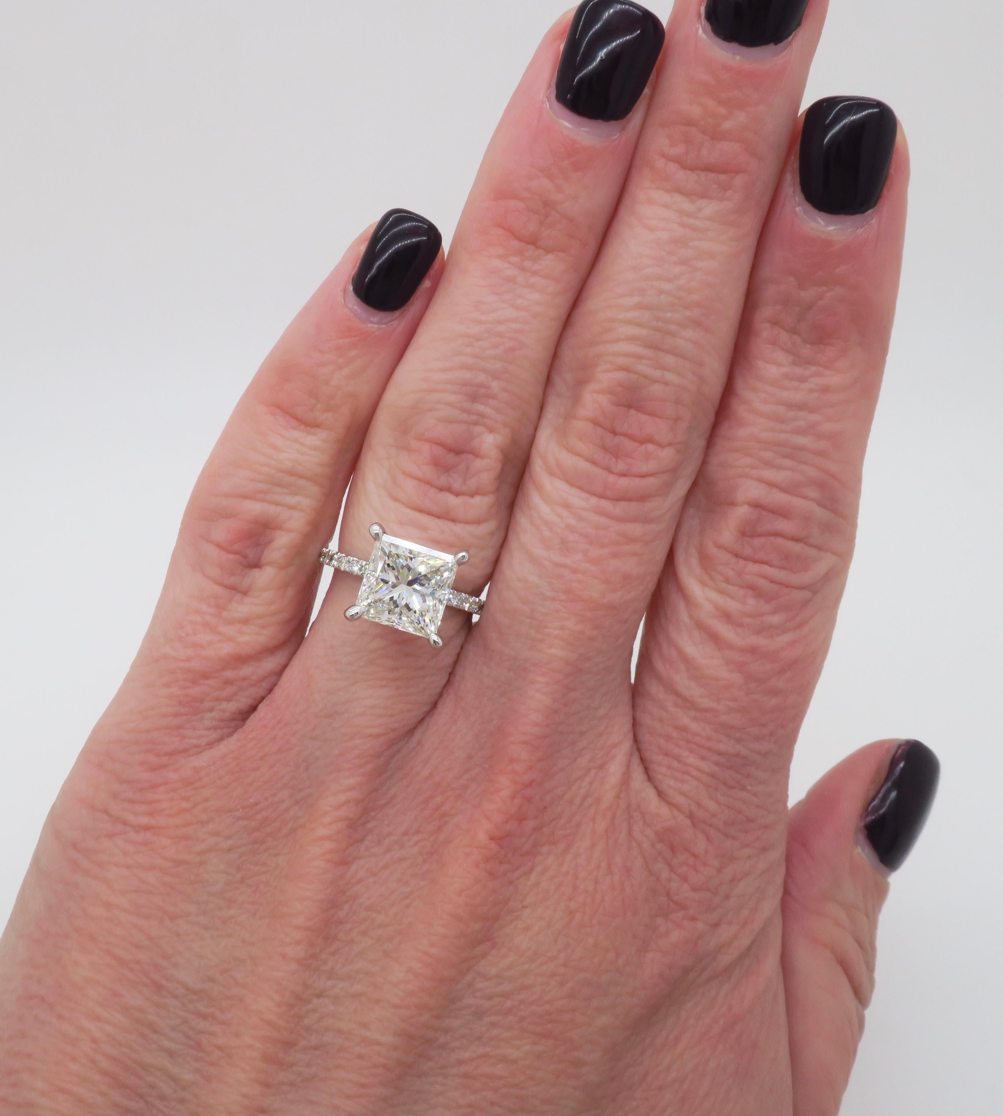 Hidden halo diamond ring set with a stunning 3.07ct GIA certified Princess cut diamond. 

Center Diamond Carat Weight: 3.07CT 
Center Diamond Cut: Princess Cut 
Center Diamond Color: I
Center Diamond Clarity: VS1
Certification: GIA -