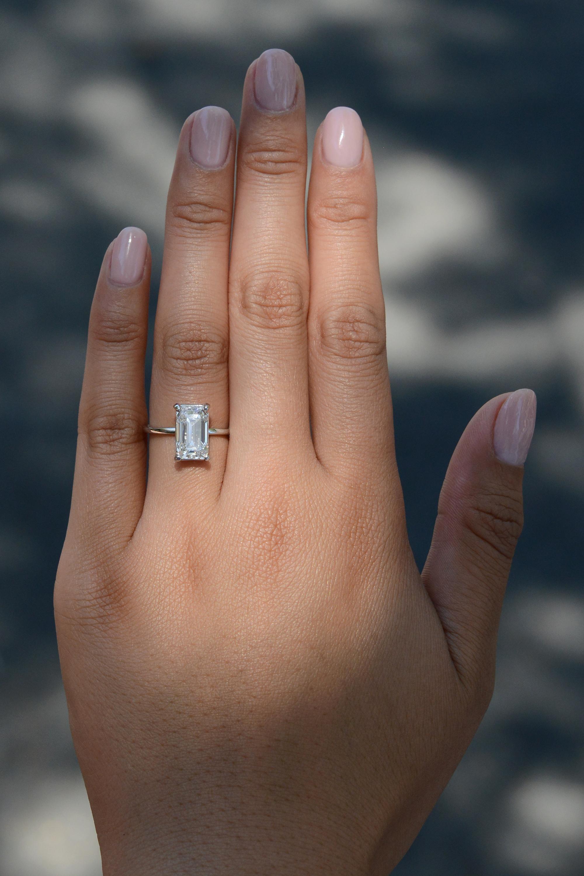 A tour de force of haute joaillerie, this exquisite emerald cut diamond ring features a mesmerizing 3.10 carat emerald cut diamond certified by the Gemological Institute of America (GIA) for its paramount quality and radiance. Graded as an F,