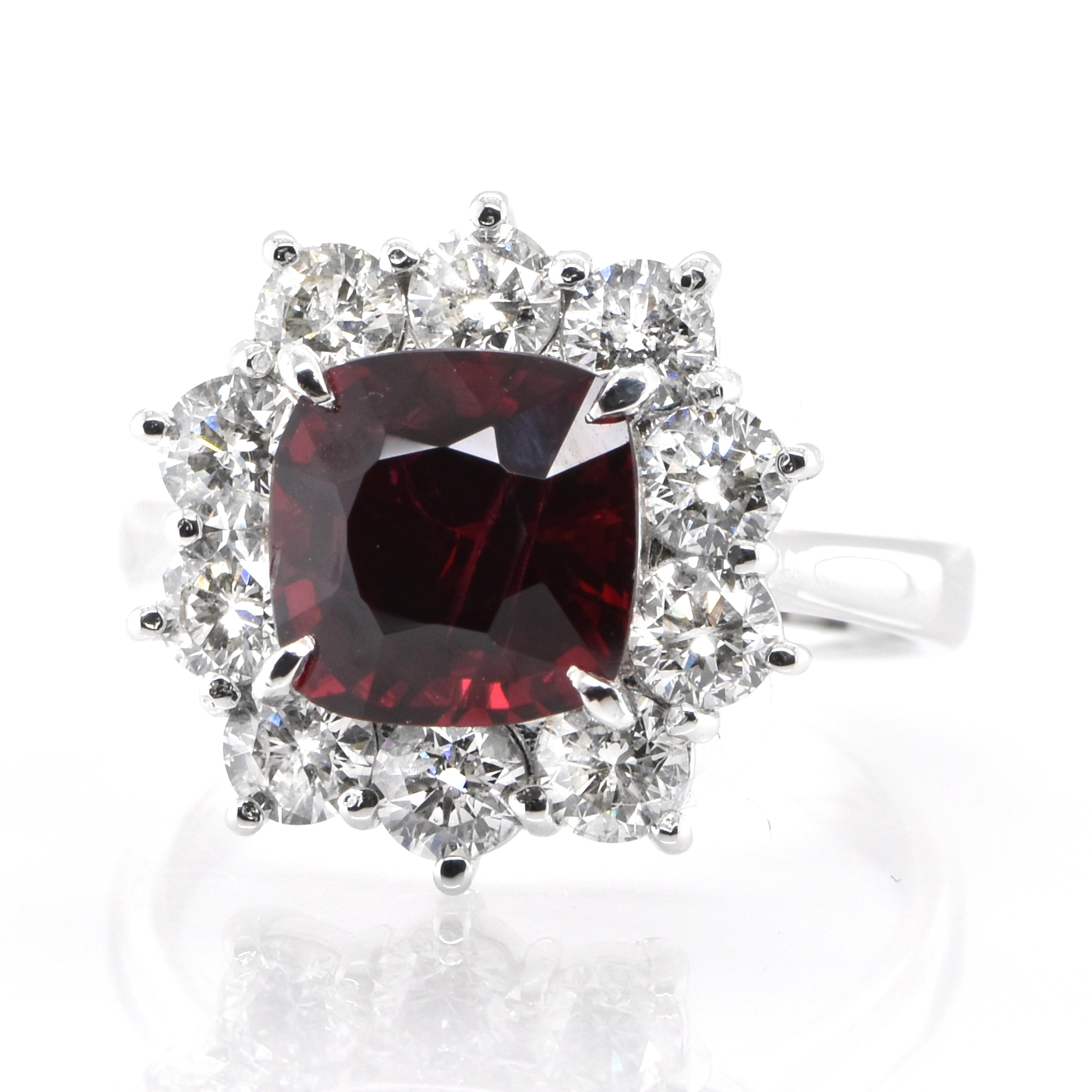 A beautiful halo ring featuring a GIA Certified 3.11 Carat Natural, No Heat, Burmese Red Spinel and 1.33 Carats of Diamond Accents set in Platinum. Spinel has been frequently confused with ruby, but it’s a gem that can stand on its own merits. Many