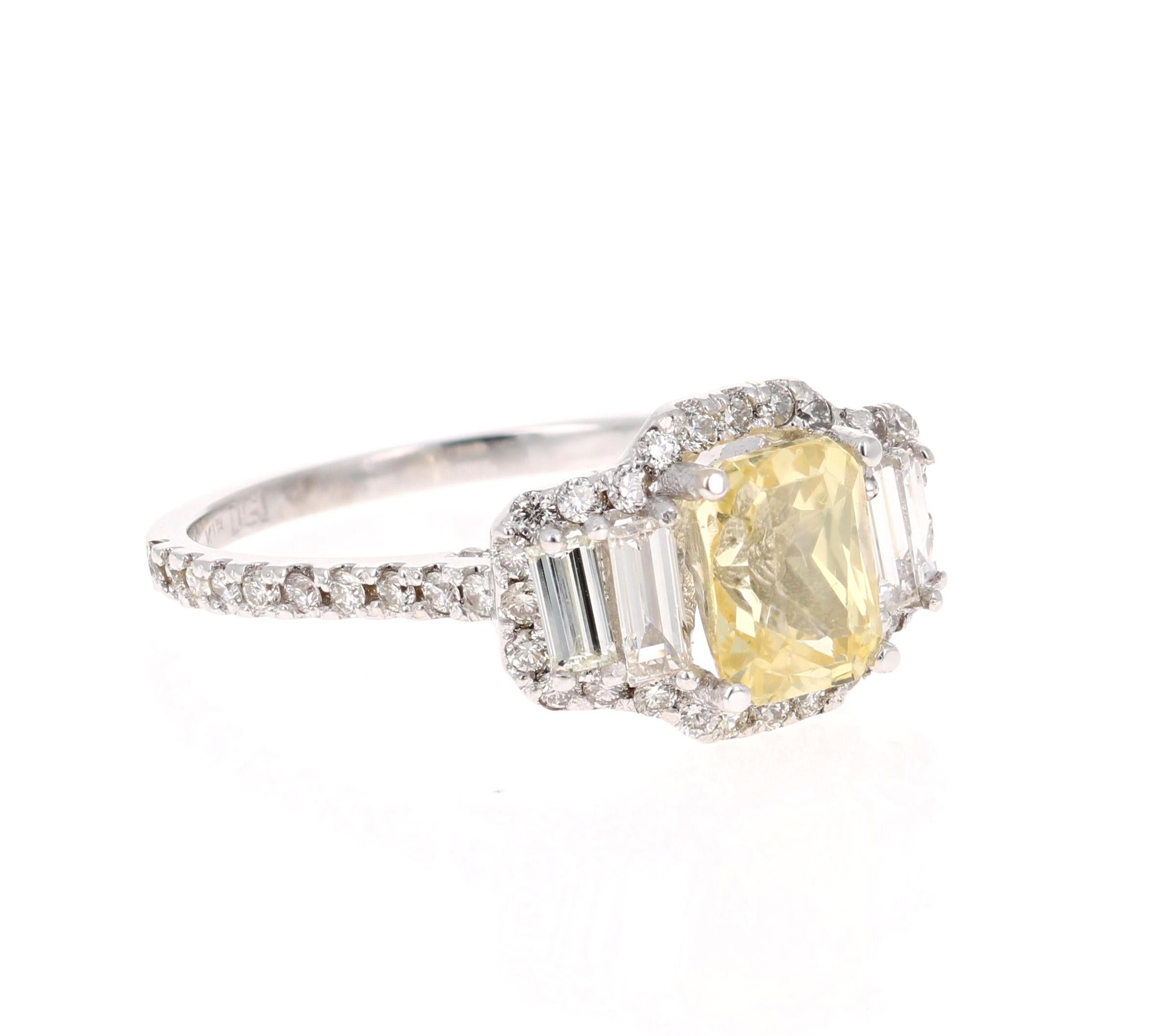 A gorgeous Yellow Sapphire Ring in a classic halo setting and resembling a three-stone ring! This gorgeous Emerald Cut Yellow Sapphire is a natural, no heat Sapphire that weighs 2.08 Carats.  
It has 86 Round Cut Diamonds that weigh 0.65 carats