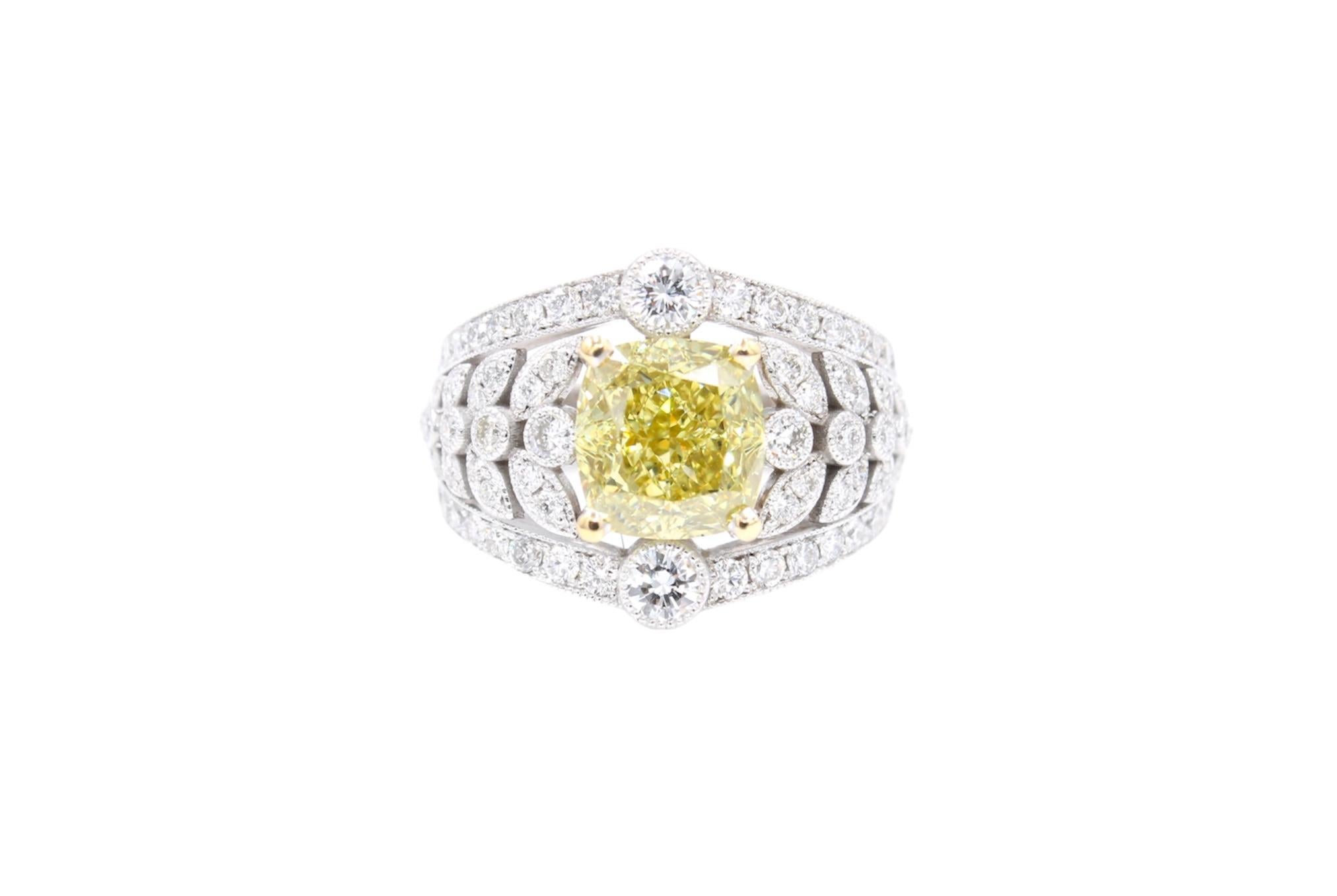 Ring made of white gold 18K set with a center GIA certified Fancy Brownish Greenish Yellow diamond of 3.15 Carats ( Vs2 clarity) surrounded by 1.10 Carats white round diamonds (G /H color - Vs clarity). 
The GIA certificate have been uploaded in the