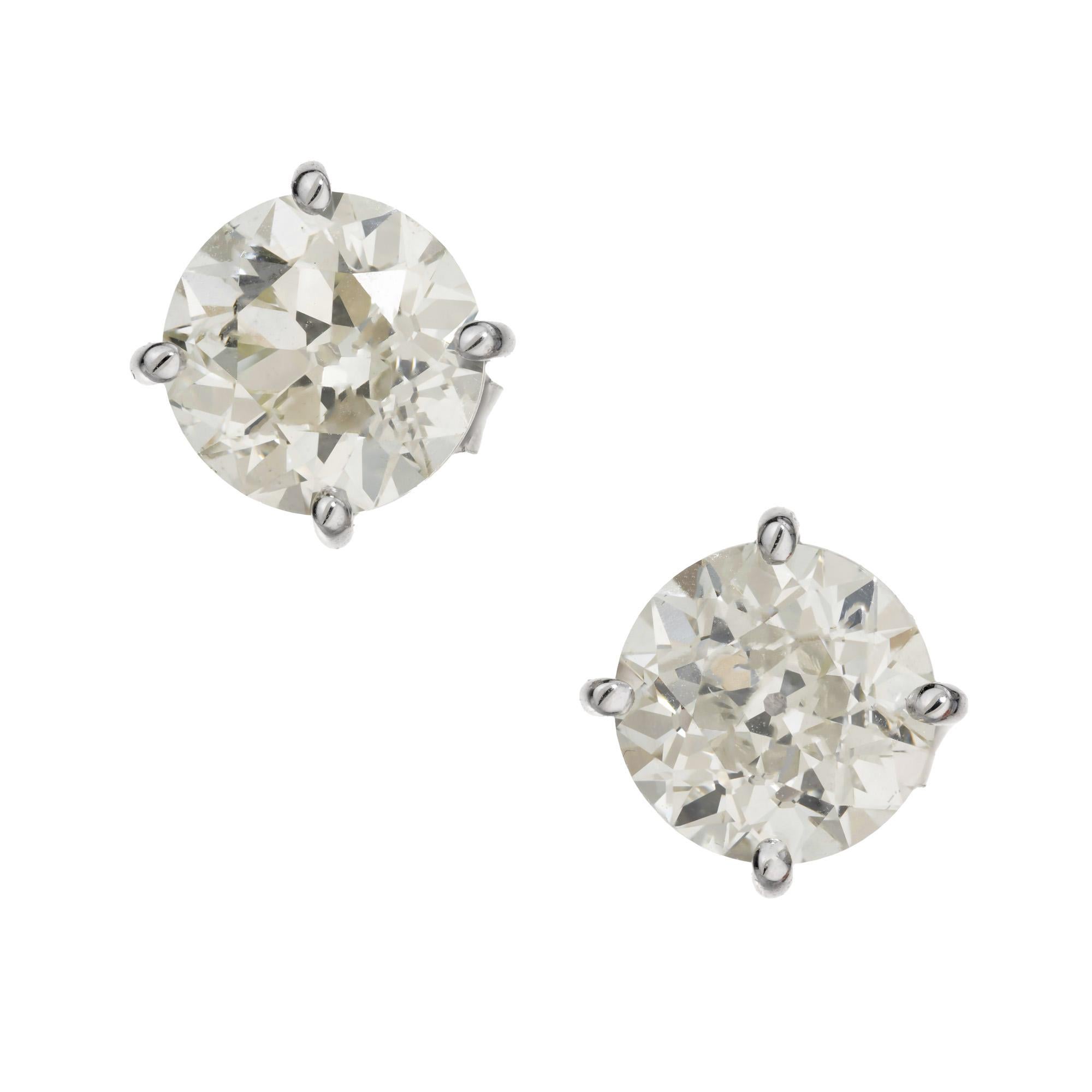Well matched diamond stud earrings. 1 Old Euro cut 1.58ct diamond with a well matched round brilliant cut 1.59ct diamond, both are set in a simple four prong platinum basket setting. They are also each certified by the GIA. 

1 old Euro cut diamond,