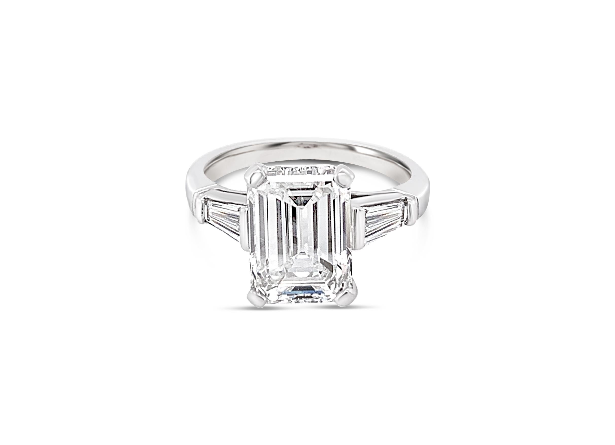 GIA Certified 3.18 Carat Emerald Cut Diamond Ring in Platinum.  Center diamond color grade is F and clarity is VS-2.  The center stone is accompanied by two tapered diamond baguettes 0.44 Carat (total weight) on the sides. 