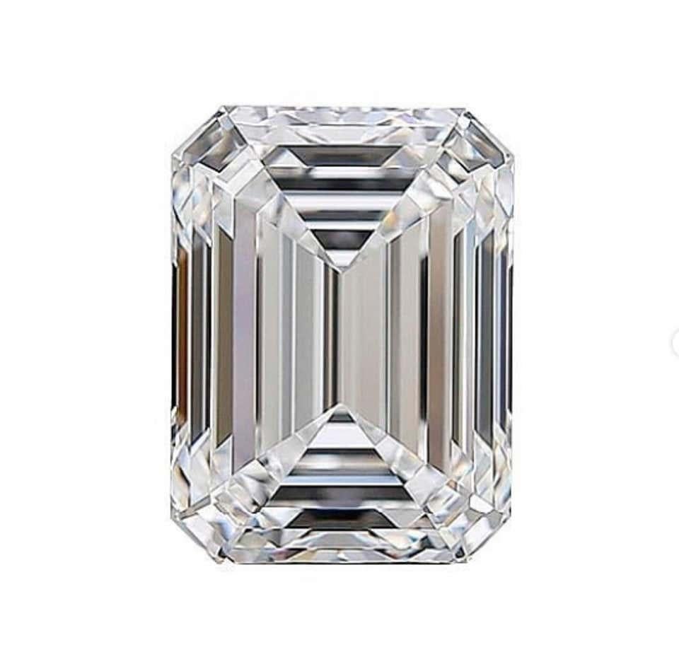 This exquisite ring is the epitome of timeless elegance and precision craftsmanship. At its heart lies a breathtaking 3 carat emerald-cut diamond, boasting an F color grade that exudes a pure and icy brilliance. The stone's internally flawless