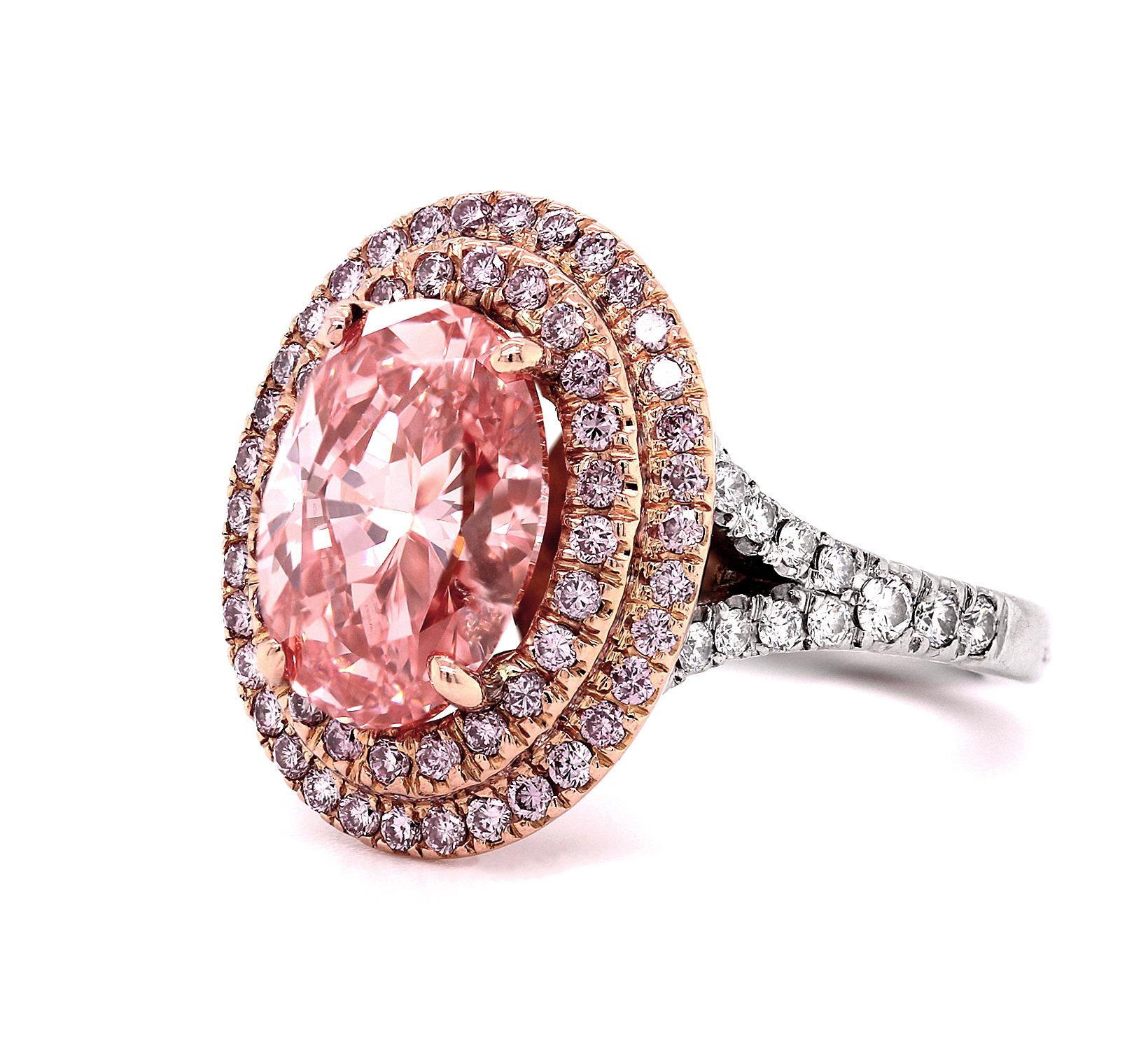 Modern GIA Certified 3.21 Ct Fancy Vivid Orangey Pink Oval Diamond Ring in Platinum