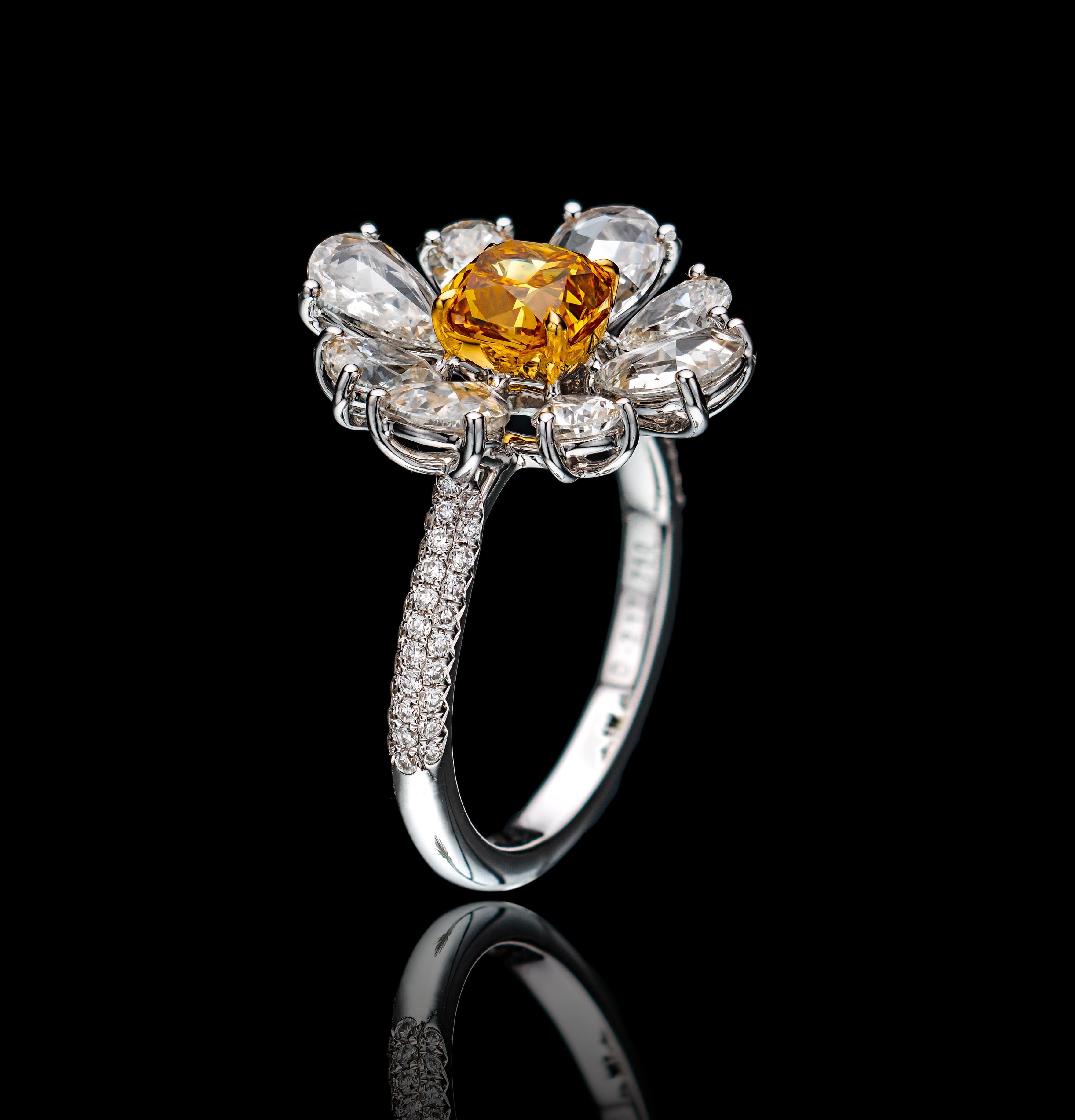 Floral motif handcrafted diamond ring that will express your love story. 
The ring showcases a gorgeous GIA certified 1.05 cushion cut fancy vivid orange yellow diamond SI1 clarity and encircled by 70 mixed shaped diamonds 2.16 Total Carat Weight