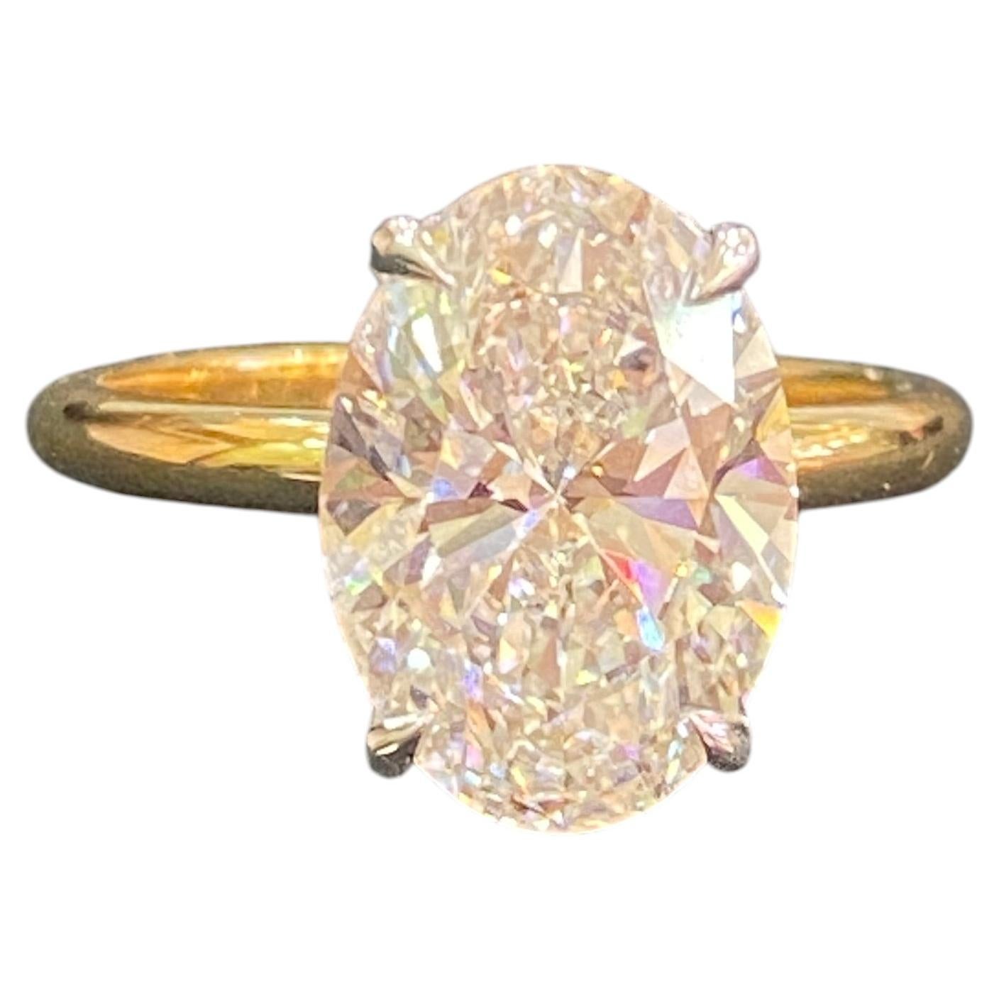 GIA Certified 3.22 Carat E VVS2 Oval Diamond Hidden Halo Ring in 18K Yellow Gold