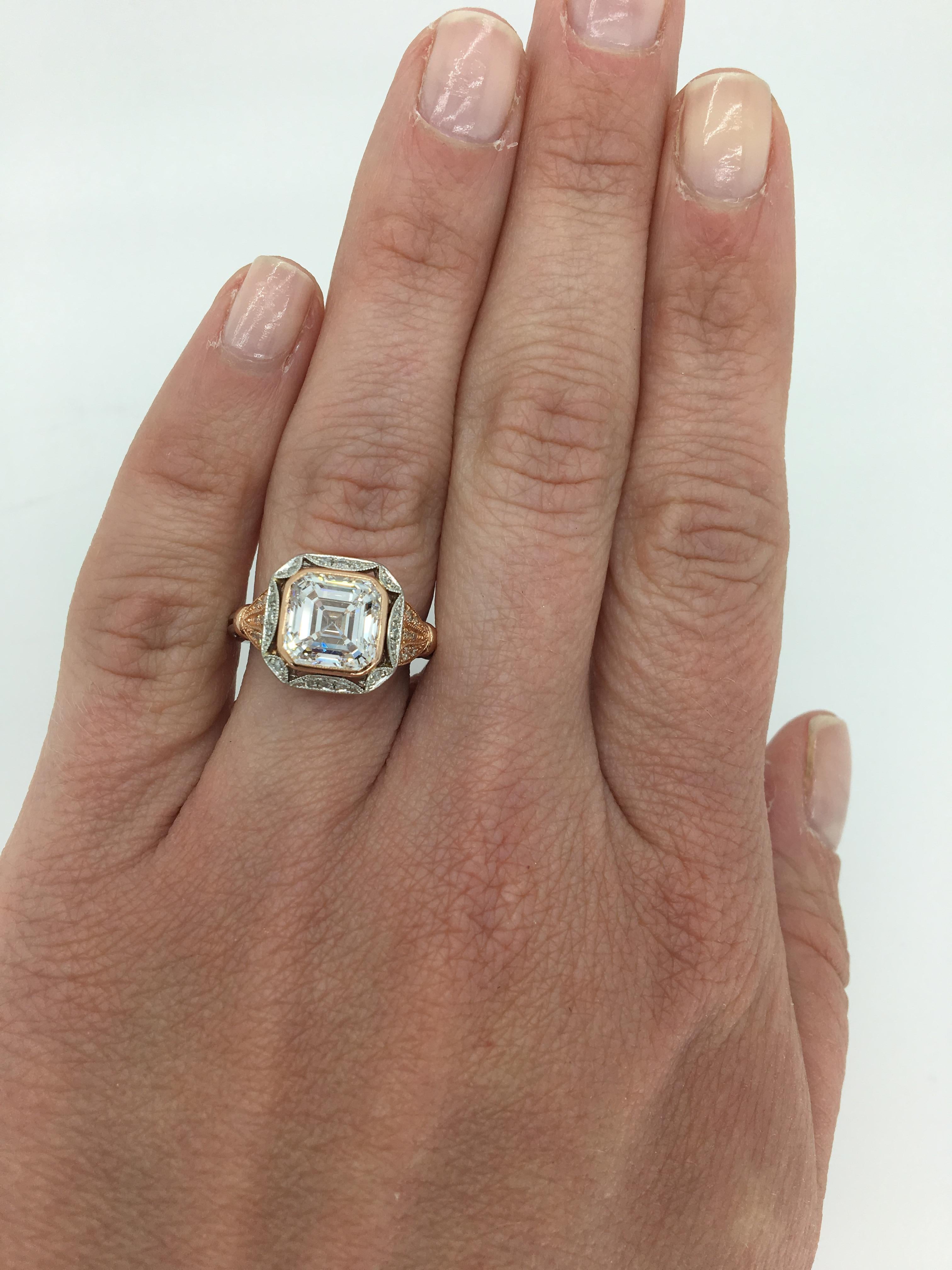 Vintage GIA certified platinum and rose gold halo style 3.01CT diamond ring.

GIA Certified: 2185170366 * COPY OF ELECTRONIC CERTIFICATION ONLY * 
Center Diamond Carat Weight: 3.01CT
Center Diamond Cut: Square Emerald Cut
Center Diamond Color: