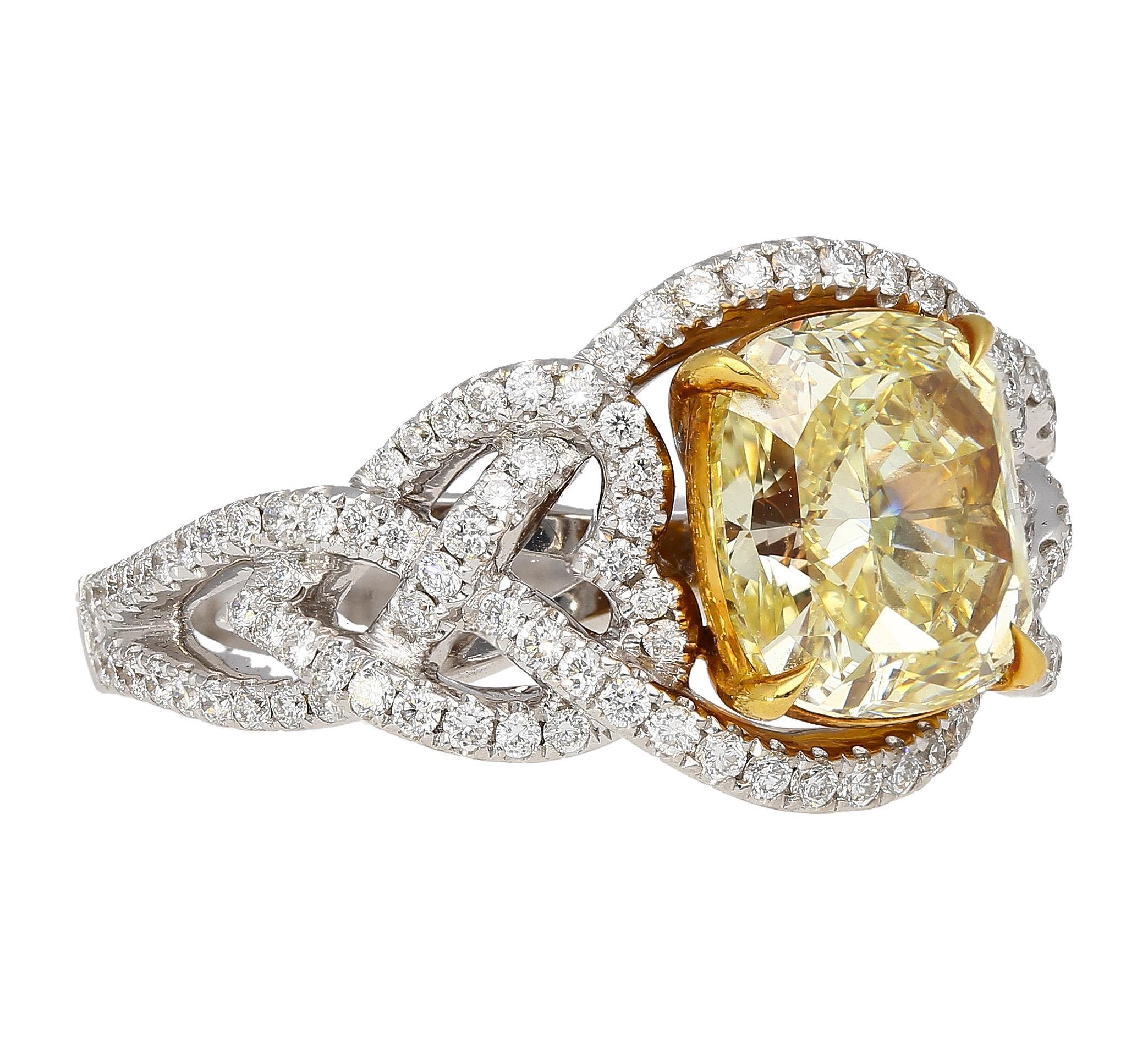 This spectacularly unique ring showcases a GIA certified 3.25 carat radiant cut fancy light yellow diamond. The gorgeous center stone has an eye-clean SI1 clarity with natural color origin and even distribution. Center stone stationed on a stunning