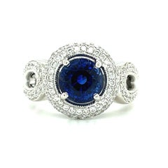 GIA Certified 3.29 Carat Round Blue Sapphire and Diamond Halo Ring in White Gold