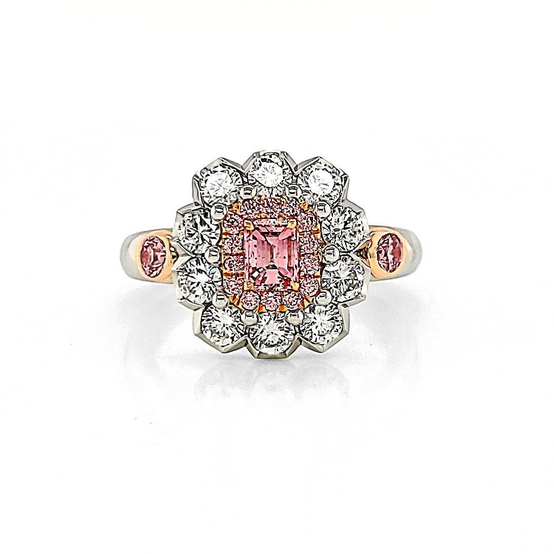 Make a captivating statement with this exquisite handmade ring featuring a fancy intense pink emerald-cut diamond as its centerpiece. Certified by GIA with the reference number 2213134086, this diamond showcases its intense pink hue and remarkable