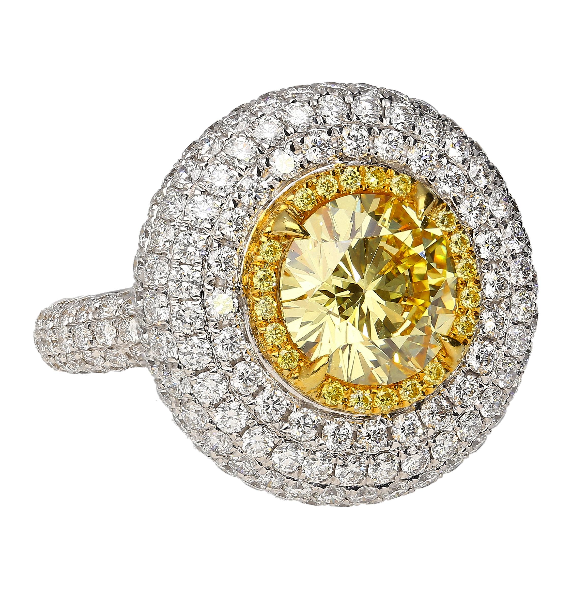 GIA certified 3.30 carat round cut fancy intense yellow diamond with internally flawless clarity. A serious investment piece. 

Details: 
Item Type: Ring
Metal: 18 White & Yellow
Weight: 11.78 Grams
Setting: Halo, Prong, Bezel
Ring Size: 6

Center