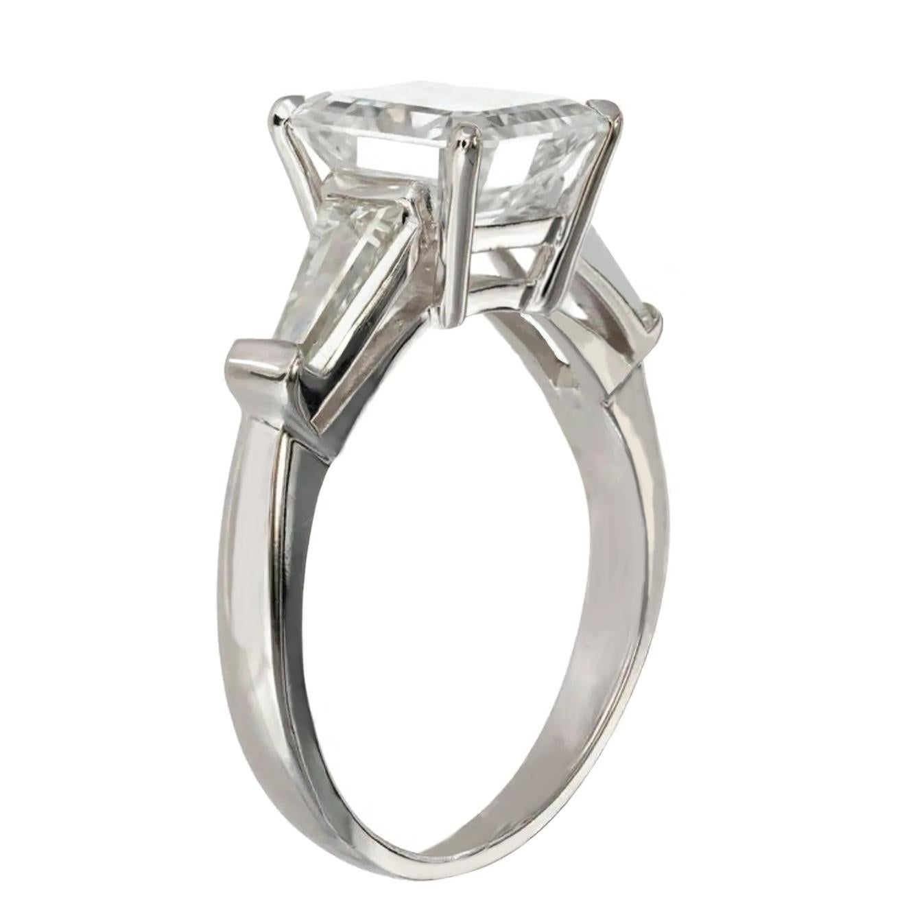 This elegant ring features a stunning 3.01 carat square emerald cut diamond as it's centerpiece, certified by GIA for exceptional quality. Set in luxurious 18K white gold, the design exudes timeless sophistication. 

The diamond’s D color grade