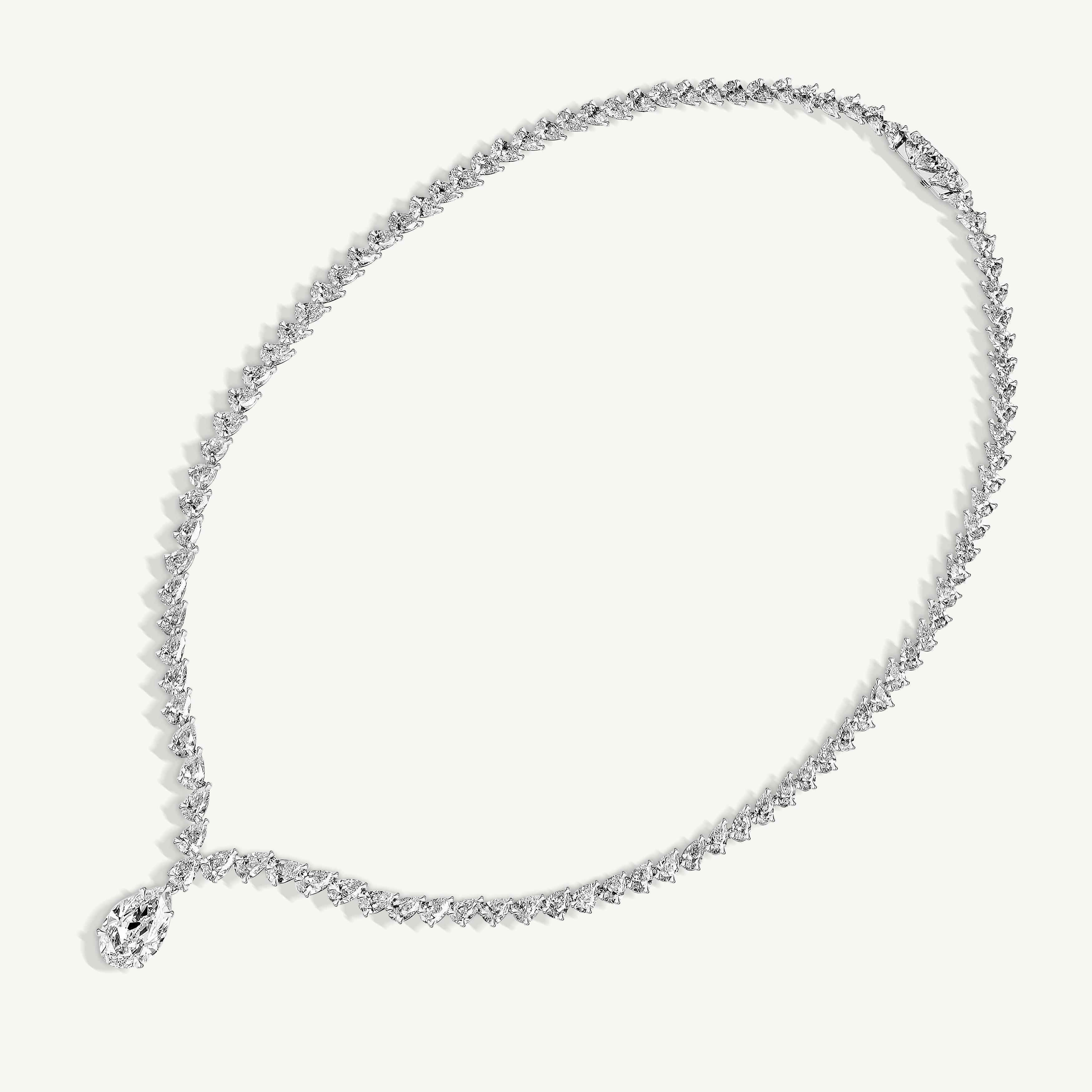 The Pear Diamond Tennis Necklace is a testament to extraordinary craftsmanship, designed for those who seek the pinnacle of luxury. Meticulously crafted in 18k white gold, this masterpiece showcases a GIA-certified 5.02ct pear-cut diamond (F/VS2)