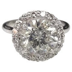 GIA Certified 3.31ct. Brilliant Cut Color J 14k White Gold with a Diamond Halo