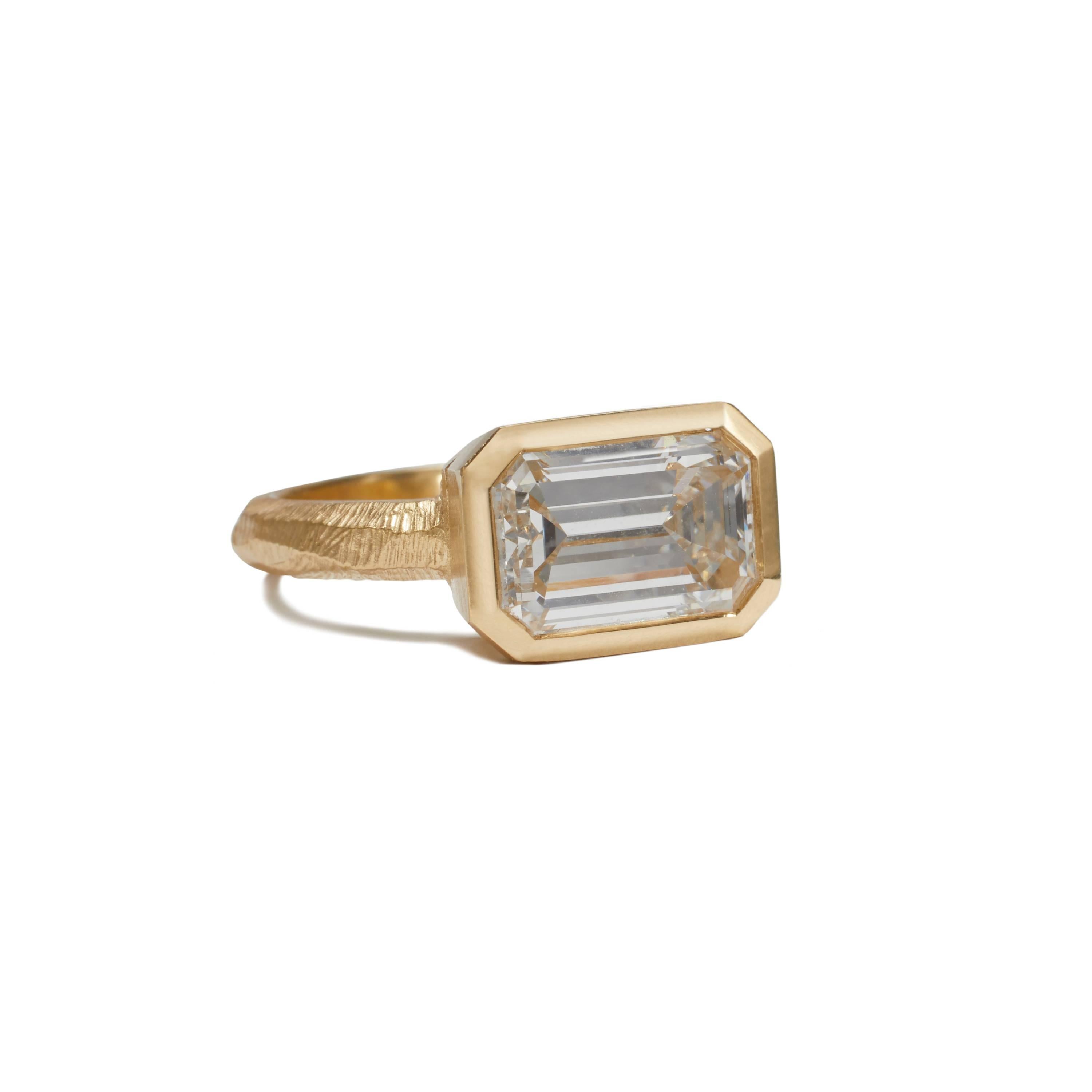 Award winning 18KT gold engagement ring with GIA Certified 3.32 Carat emerald cut diamond designed and made by Page Sargisson with recycled gold.  

The ring won 3rd place in the 2018 InStore Magazine's Design awards in the Engagement Ring