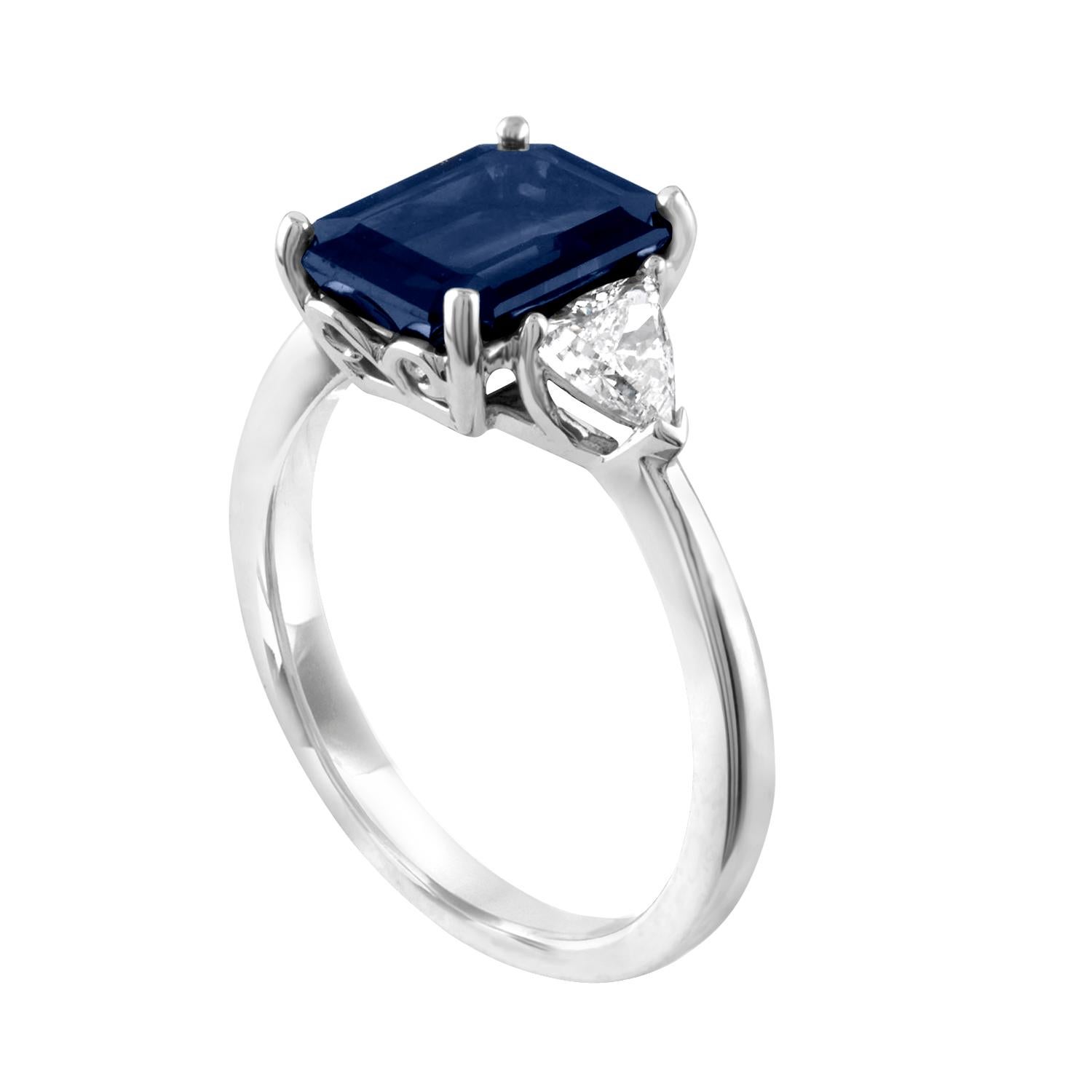 Stunning Three Stone Sapphire Ring
The ring is 18K White Gold
The Center stone is 3.33 Carats Dark Blue Sapphire
The Sapphire is GIA Certified Octagonal Step Cut Heated
There are 2 trillion Diamonds 0.52 Carats F VS
The ring is a size 6.75,