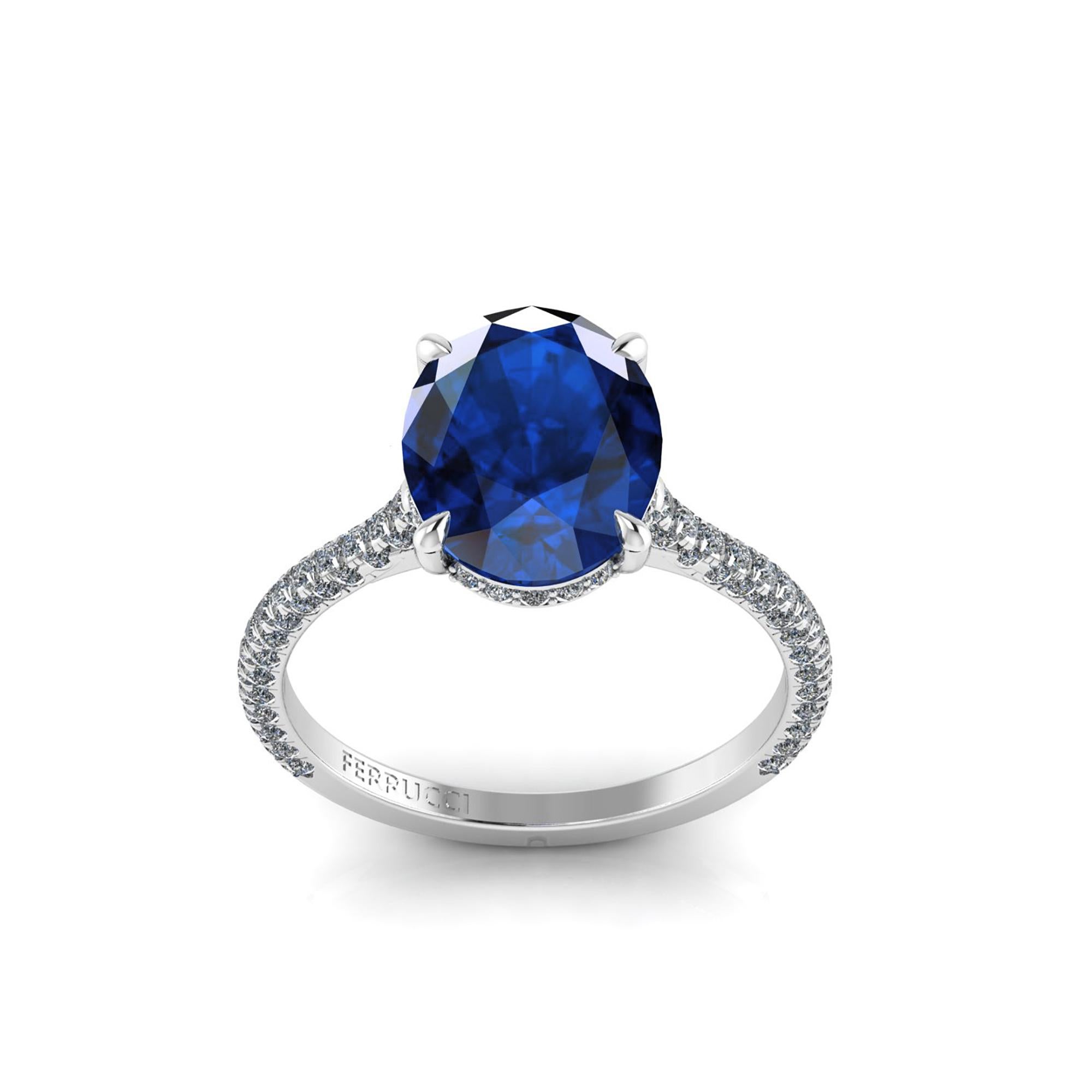 GIA Certified 3.34 carat from Madagascar, blue Oval Sapphire,  conceived in an hand made Platinum ring,
adorned with a shower of ultra white diamonds, hand set on almost every surface to give the maximum light reflection and sparkle.
The total carat