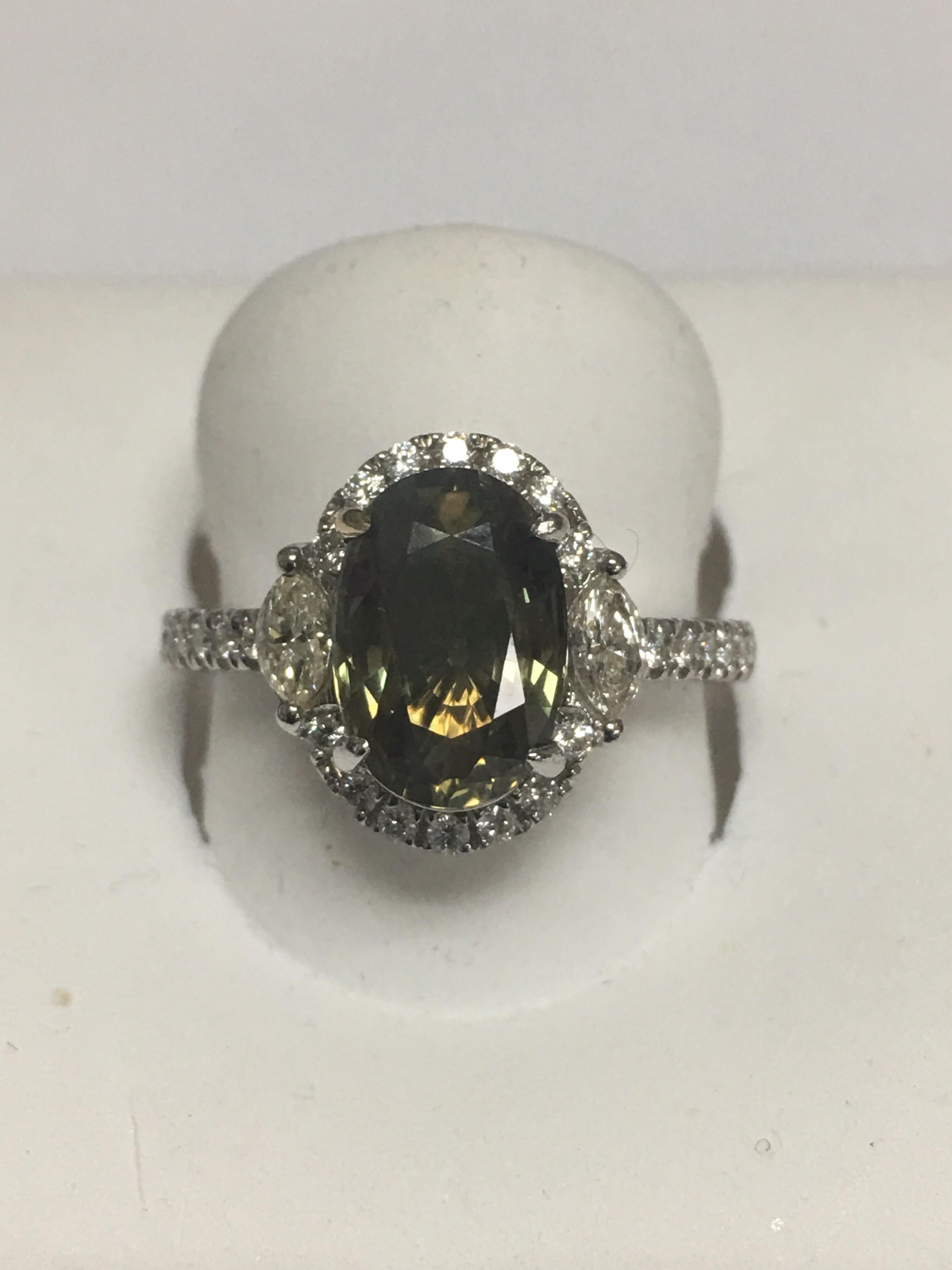 GIA Certified 3.35 Carat Alexandrite and 0.57 Carat White diamond set in 18 Karat White Gold.The Ring is one of a kind handcrafted by skilled craftsman.Size of the Ring is 7 and can be resized if needed. 