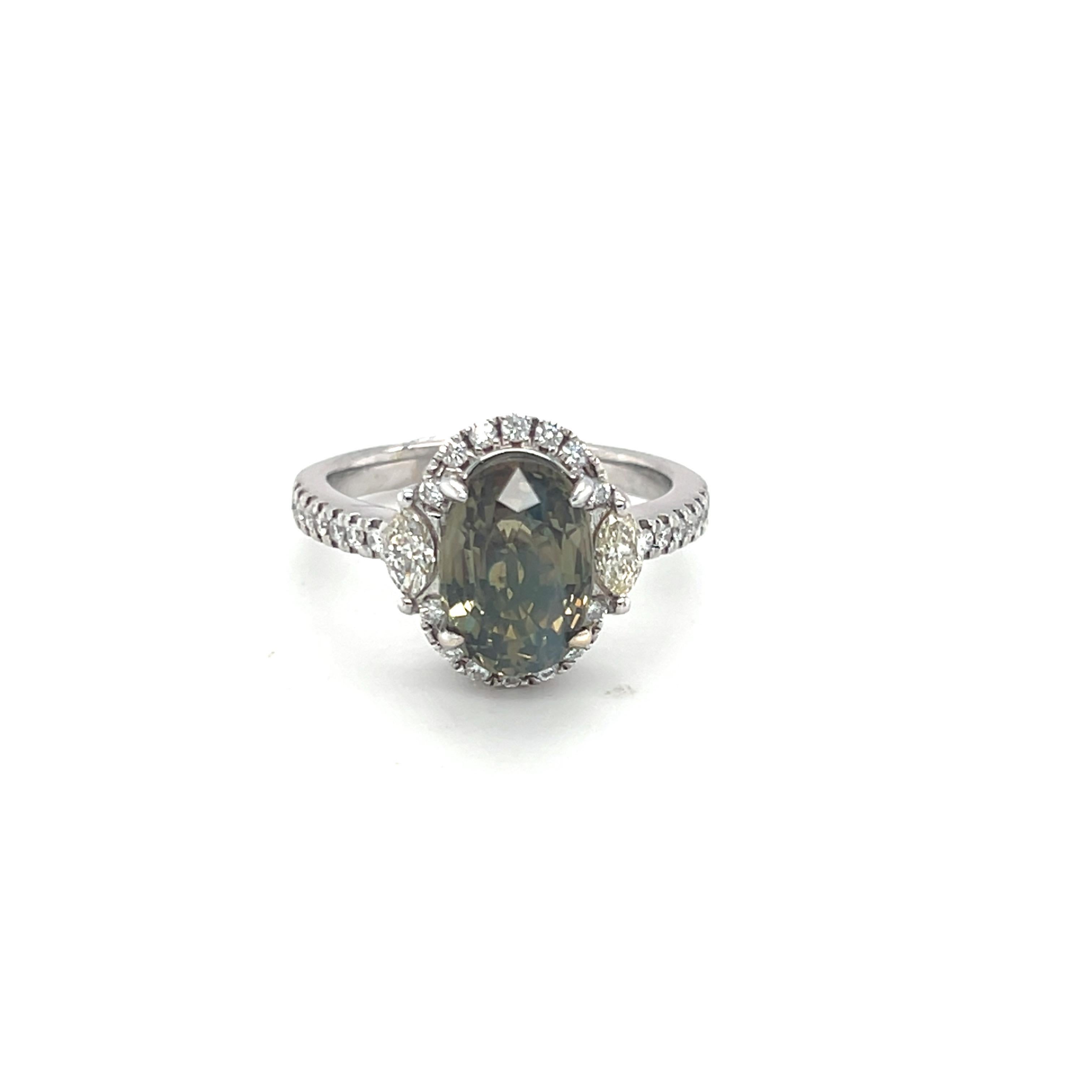 This stunning GIA-certified 3.35-carat alexandrite diamond ring features an oval-cut alexandrite at its center, encircled by 0.33 carat dazzling halo of diamonds. The band is adorned with pave-set diamonds, totaling 0.24 carats. The ring is size 7