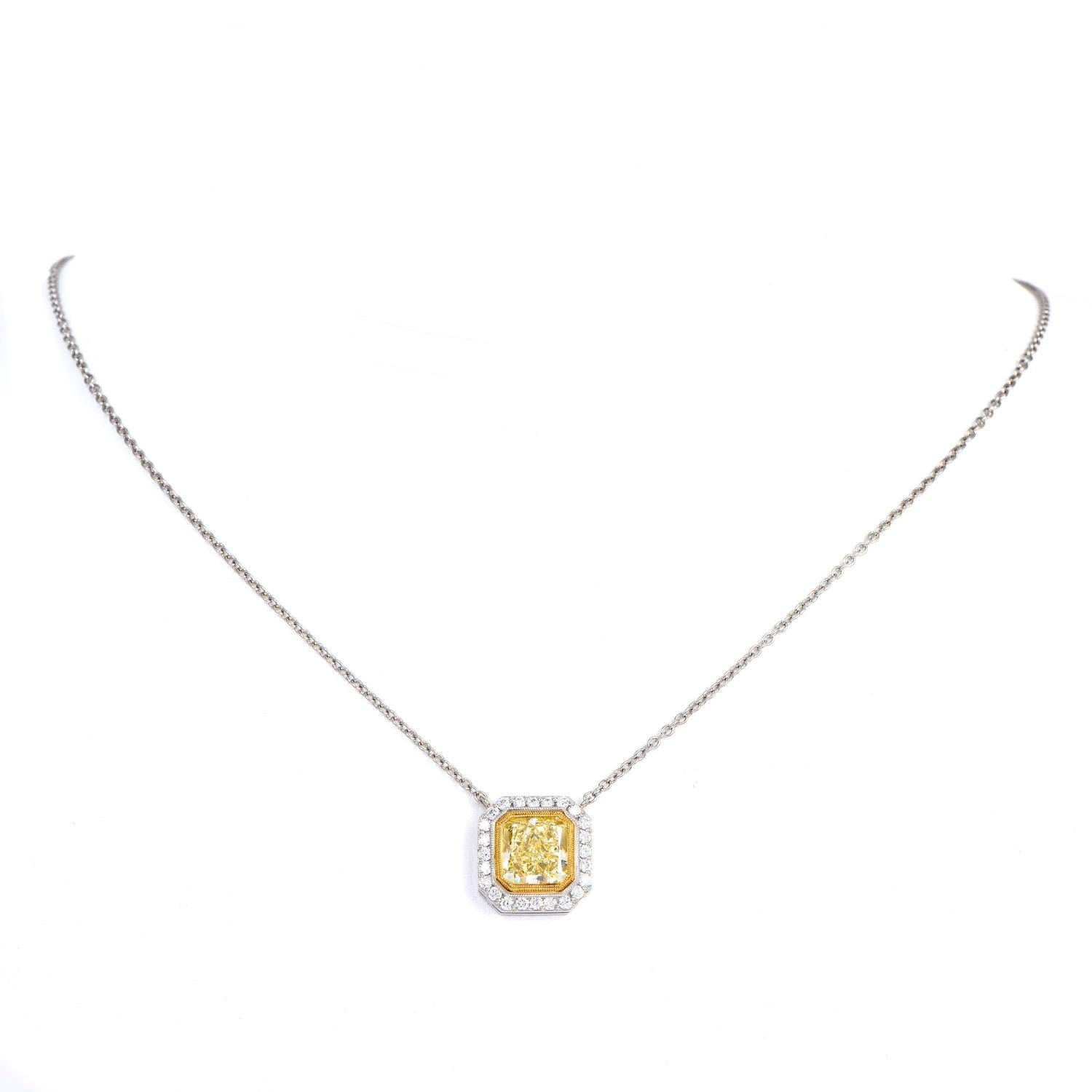This luxurious yellow diamond cushion-shaped pendant link chain necklace brings the classic look to a new level. 

Crafted in Platinum with 18K yellow gold accents. 

Featuring a vibrant fancy yellow Natural Diamond in the center, creating a
