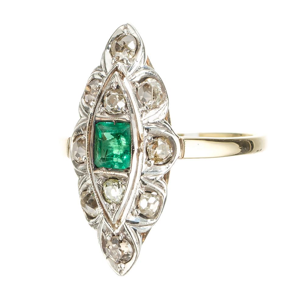 1930's Art Deco emerald and diamond ring. GIA Certified natural octagonal emerald center stone set in 14k white gold top with a halo of 10 old mine cut diamonds with natural brown and yellow tones, one which has a small chip at the crown. The