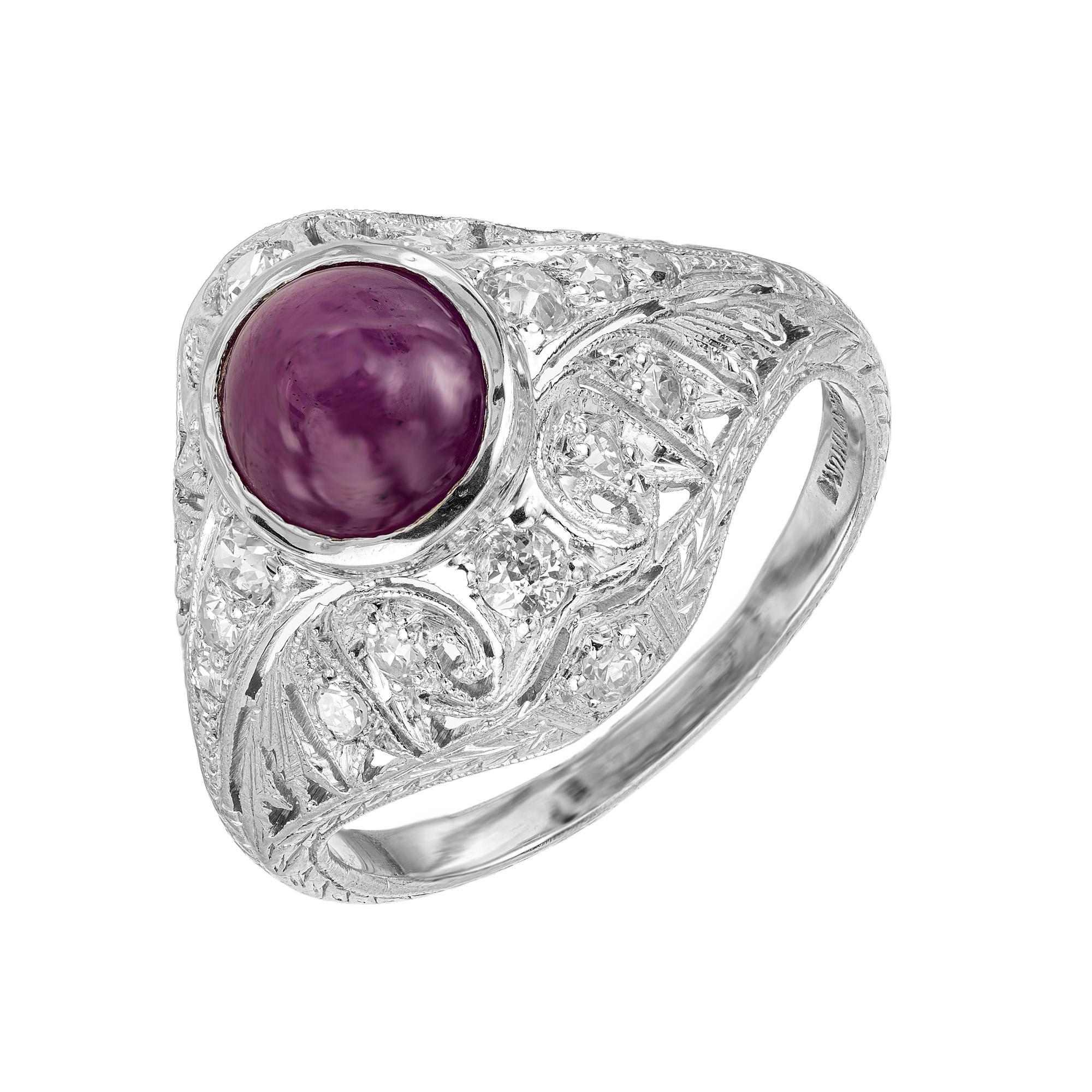 This dazzling 1920's Art Deco masterpiece begins with a oval cabochon 3.40ct Star ruby which is mounted in a platinum filigree setting. 18 round cut diamonds adorn the dome style crown. Certified by the GIA as natural, no treatment and as a star