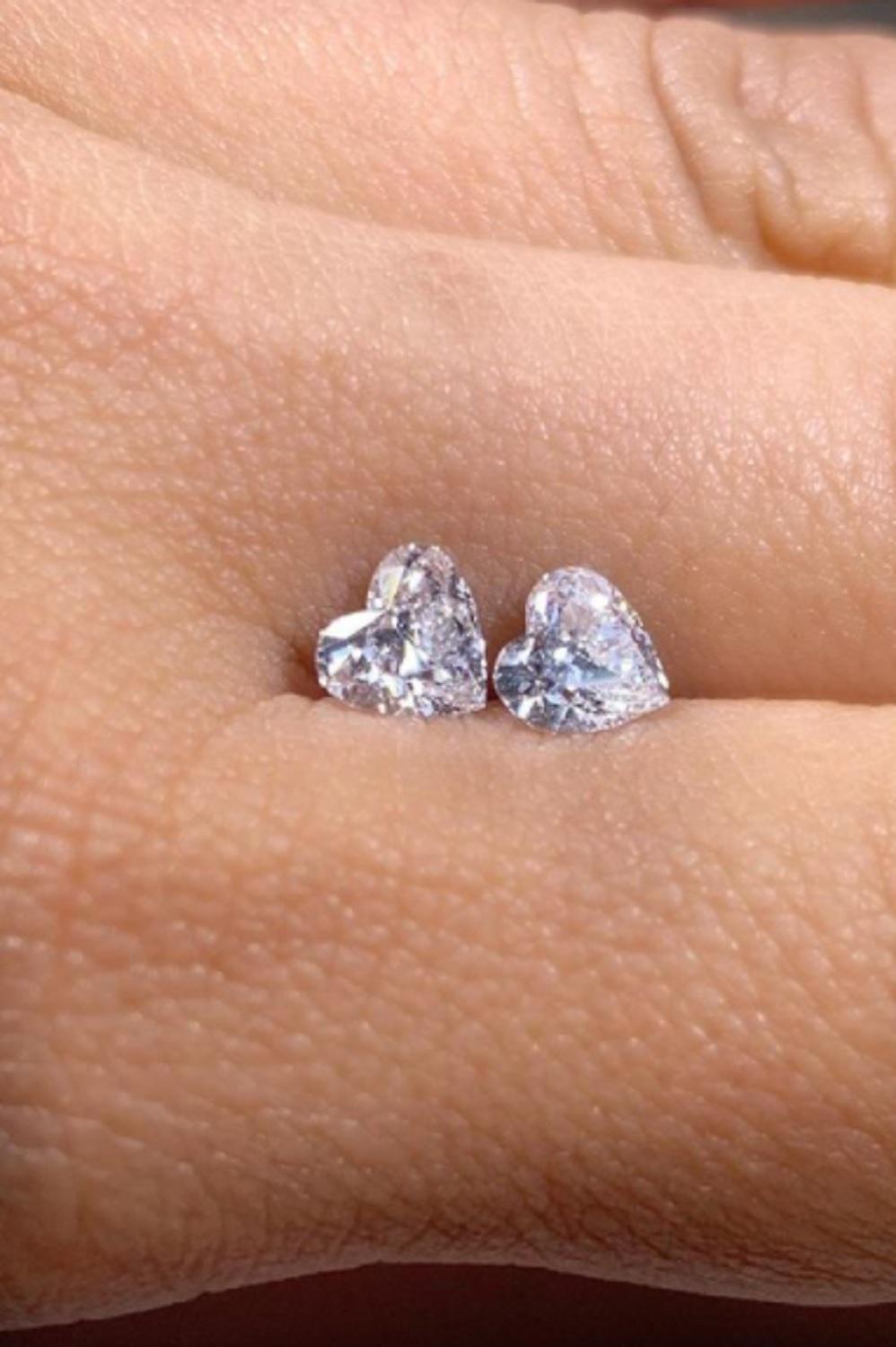 GIA Certified 3 Carats Heart Cut Diamond Studs with halo of very pure diamonds set in platinum 