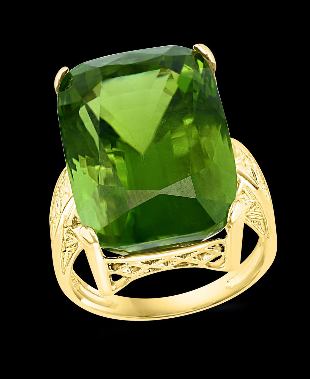 A classic, Cocktail ring 
Huge 34.06  Carat of very clean no inclusion  Peridot full of luster and shine  ring
Gold: 14 carat Yellow gold 
Weight: 12 gram
GIA Certified 
Certificate Report # 2205658214
Shape Cushion
Size 7.5
If you need the ring