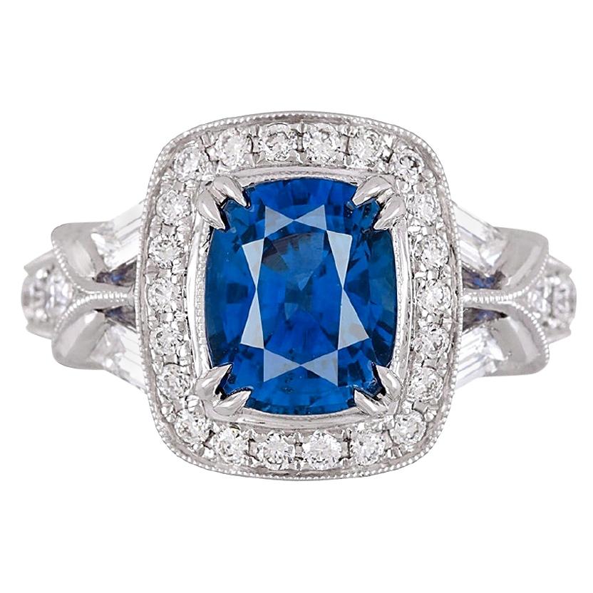 With a GIA Certified 3.42 carat cushion cut Ceylon sapphire center, and 1.06 carats white diamonds, this ring shines from every angle. Intricate hand engraved milgrain work throughout adds to the charm of the piece.

GIA Certification details (see