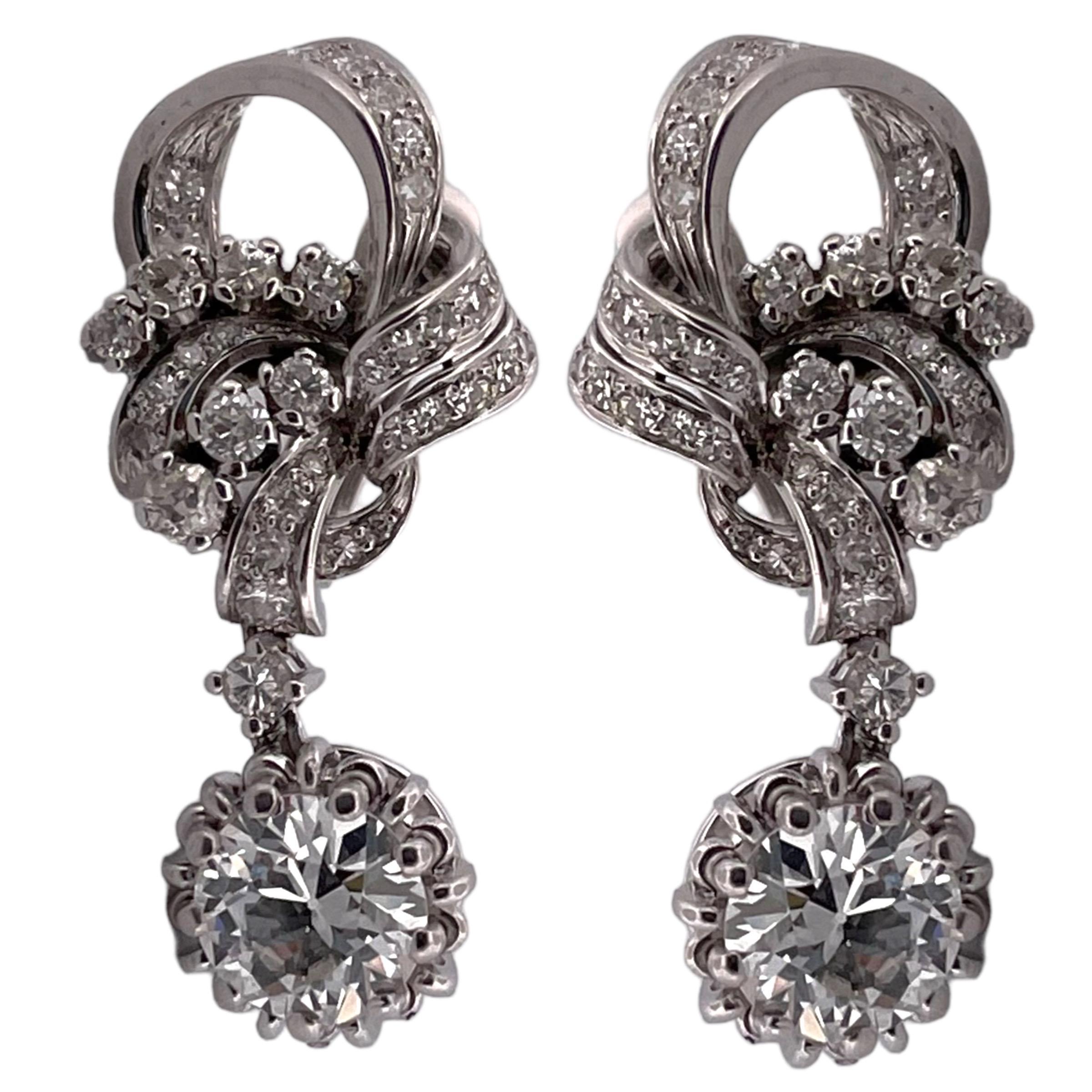 Discover the elegance of yesteryears with our exclusive GIA-certified platinum antique earrings, boasting a total carat weight (TCW) of 3.44. These exquisite vintage pieces blend timeless craftsmanship with the luxury of platinum, making them a