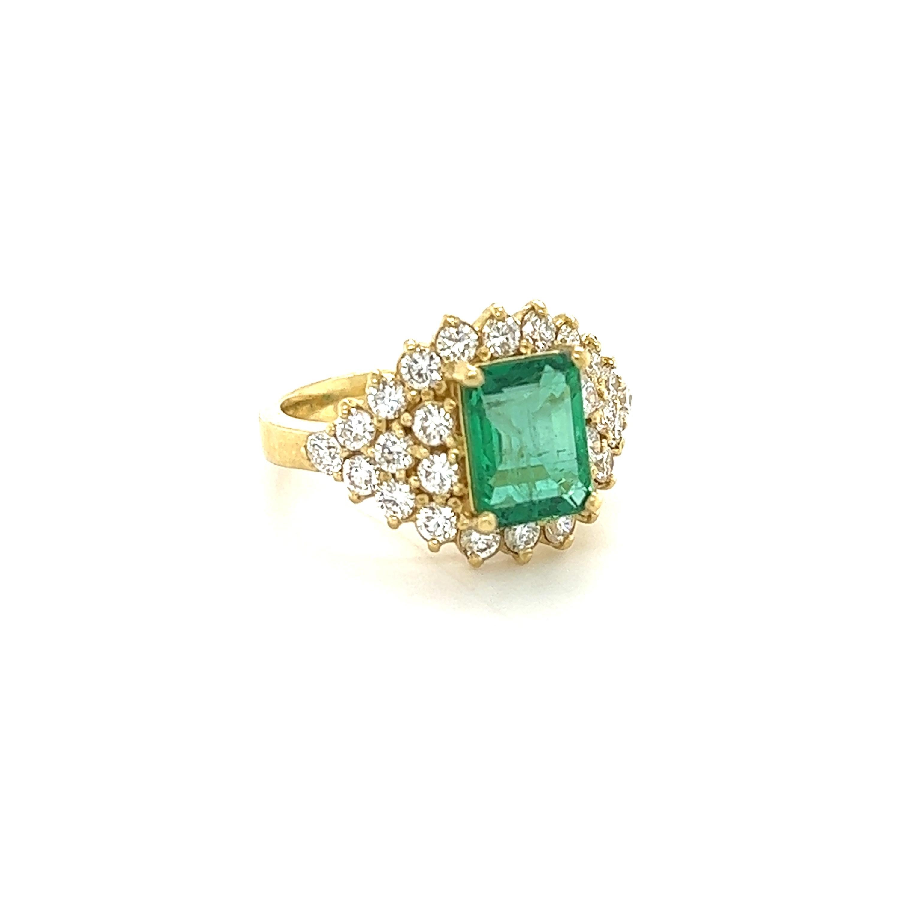 This ring has a 2.11 Carat Emerald Cut Emerald that is set in the center of the ring. It measures at 9 mm x 7 mm. The Emerald is surrounded by Natural Round Cut Diamonds that weigh 1.35 carats. (Clarity: SI1, Color: F) The total carat weight of the