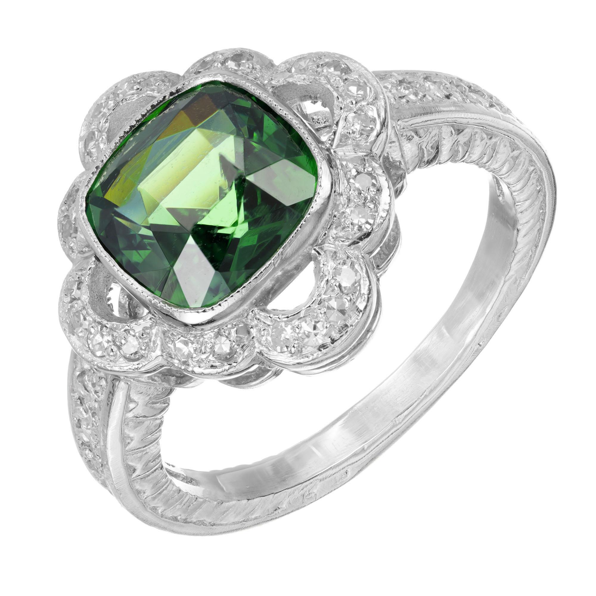 Green Zircon and diamond engagement ring. GIA natural untreated green center cushion shape Zircon, in a platinum setting with a halo of 46 round diamond's. The setting is original Platinum circa 1920-1930 with engraving and pave side diamonds. Stone