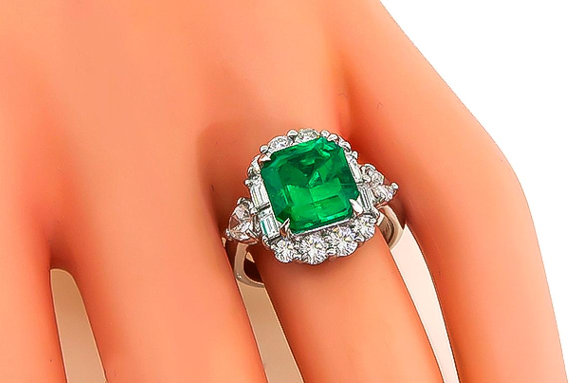 This amazing platinum ring is centered with a stunning GIA certified octagonal cut natural Colombian emerald that weighs 3.48ct. The emerald is accentuated by dazzling baguette, heart and round cut diamonds that weigh 1.31ct. graded G color with
