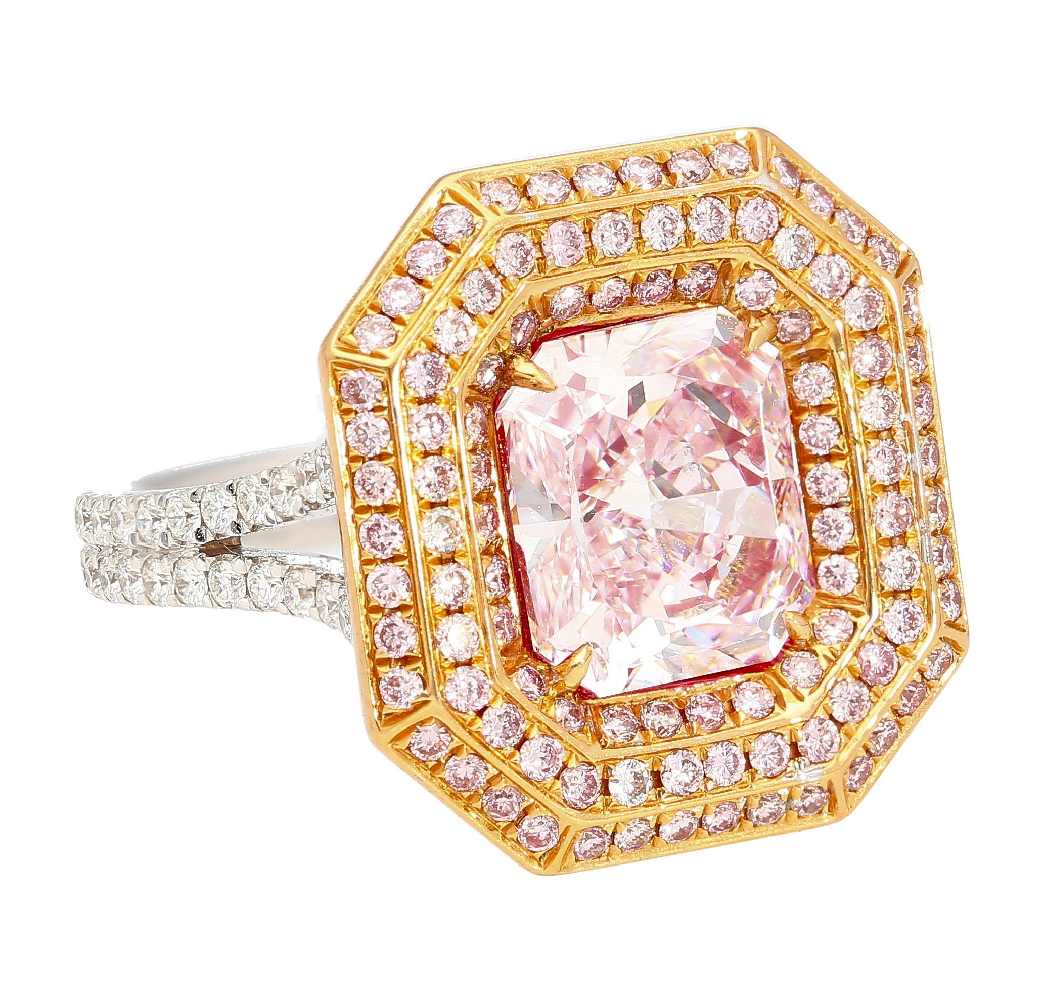 GIA Certified natural 3.48 carat fancy light pink radiant cut SI1 clarity diamond ring. Set in 18k white and rose gold with a triple halo of round brilliant-cut pink diamonds. Wide frame with a cathedral and split shank of pave set white diamonds.