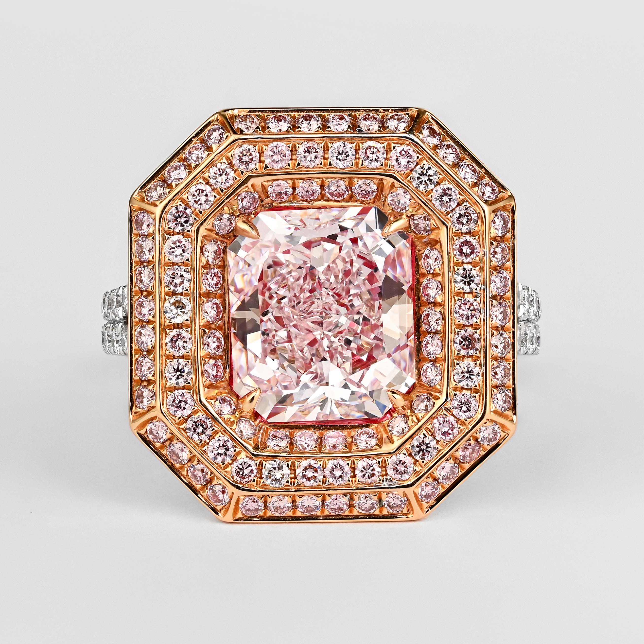 GIA Certified natural 3.48 carat fancy light pink radiant cut SI1 clarity diamond ring. Set in 18k white and rose gold with a triple halo of round brilliant-cut pink diamonds. Wide frame with a cathedral and split shank of pave set white diamonds.