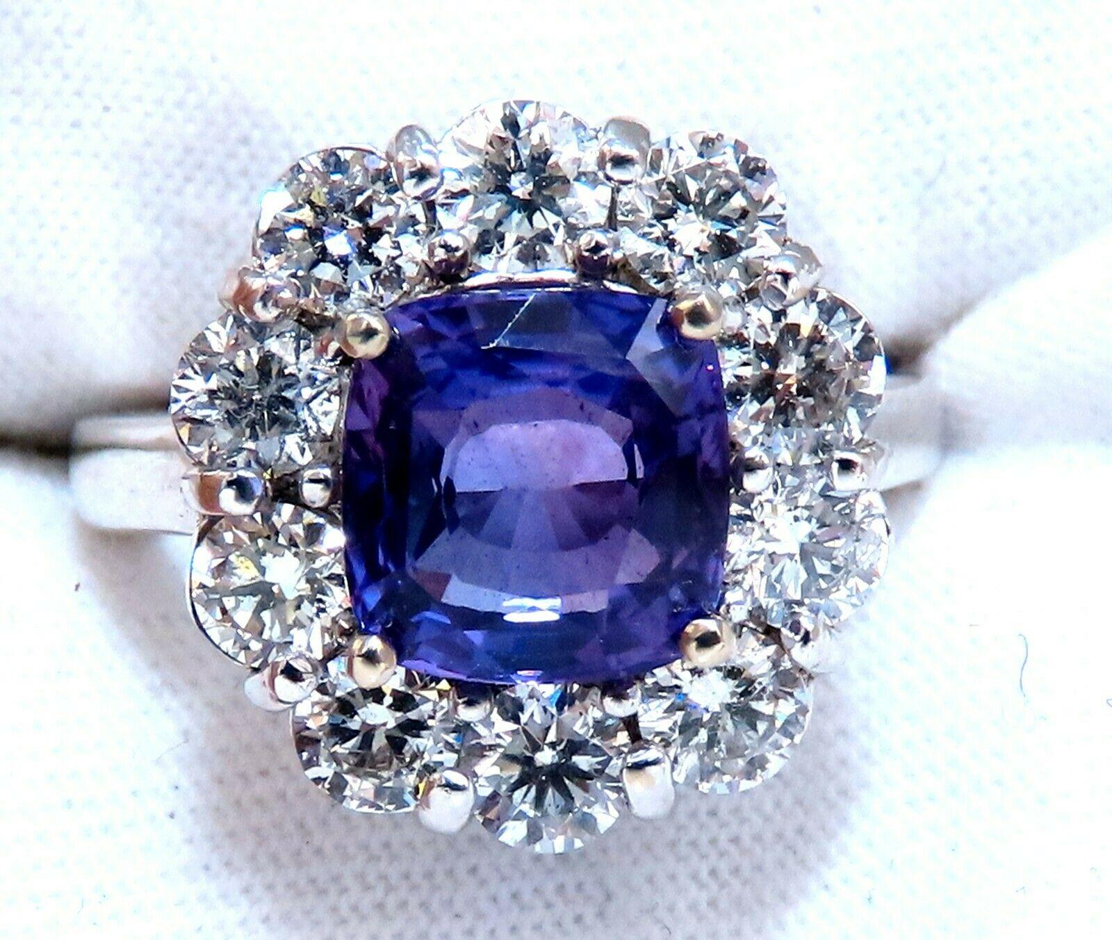 Purple Cluster Halo

GIA Certified 

3.48ct. Natural Sapphire ring.

Report:  1357608728

Cushion cut: 8.51 X 8.35  X 4.60mm

Transparent, Vivid Purple & Clean Clarity.

No Heat



1.33ct. Side natural round diamonds: 

G-color, Vs-2 clarity.

14kt.