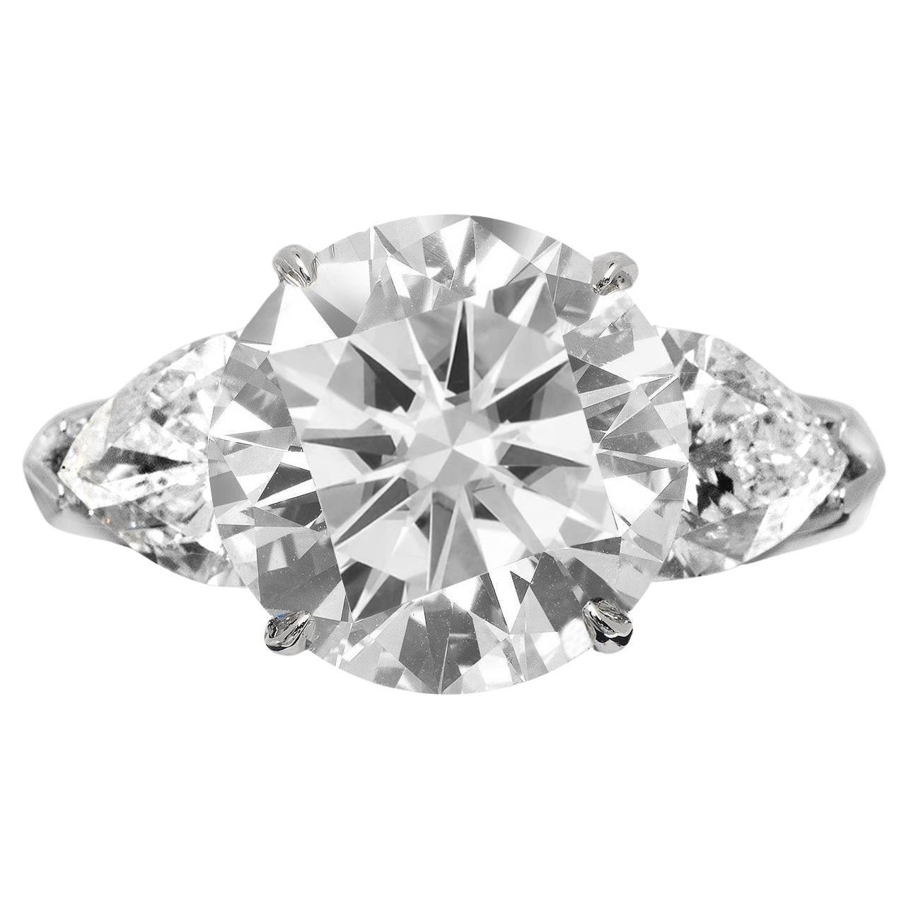 Anillo de platino con diamante talla redonda de 3.01 quilates certificado por GIA y diamante talla pera