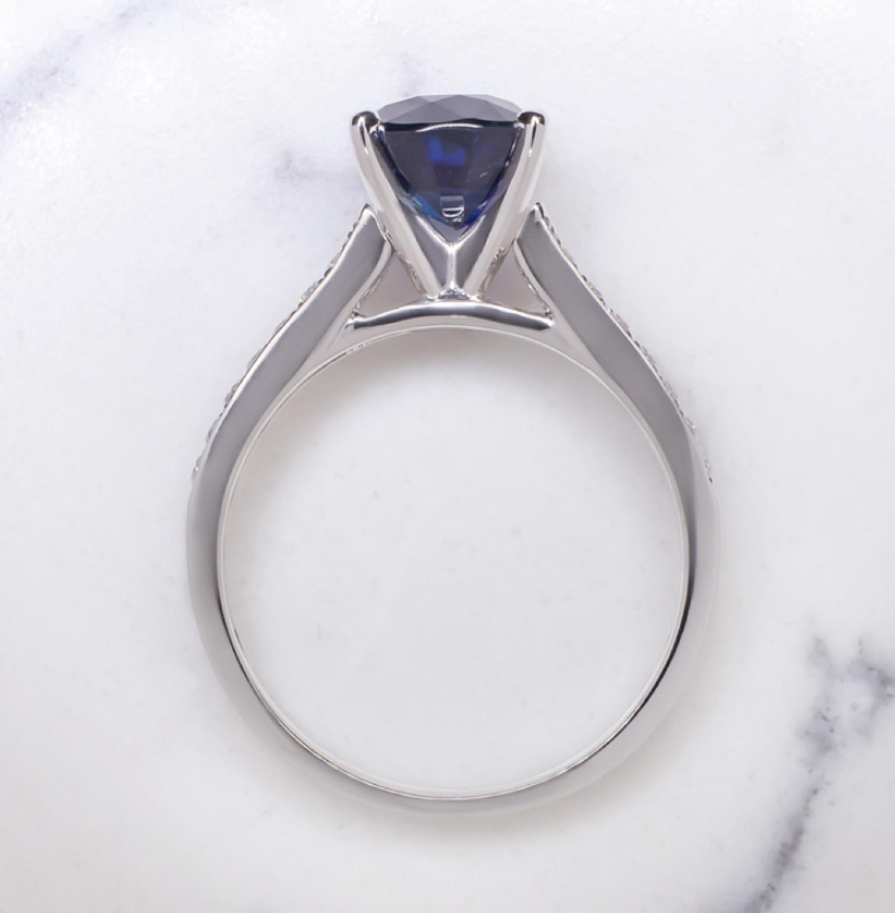 The 3.55 emerald cut sapphire ring is a gorgeous royal blue color. It is a beautiful true blue that is perfectly set off by the diamond accents. The shoulders of the elegant and luxuriously substantial setting glitter with two rows of diamonds for a