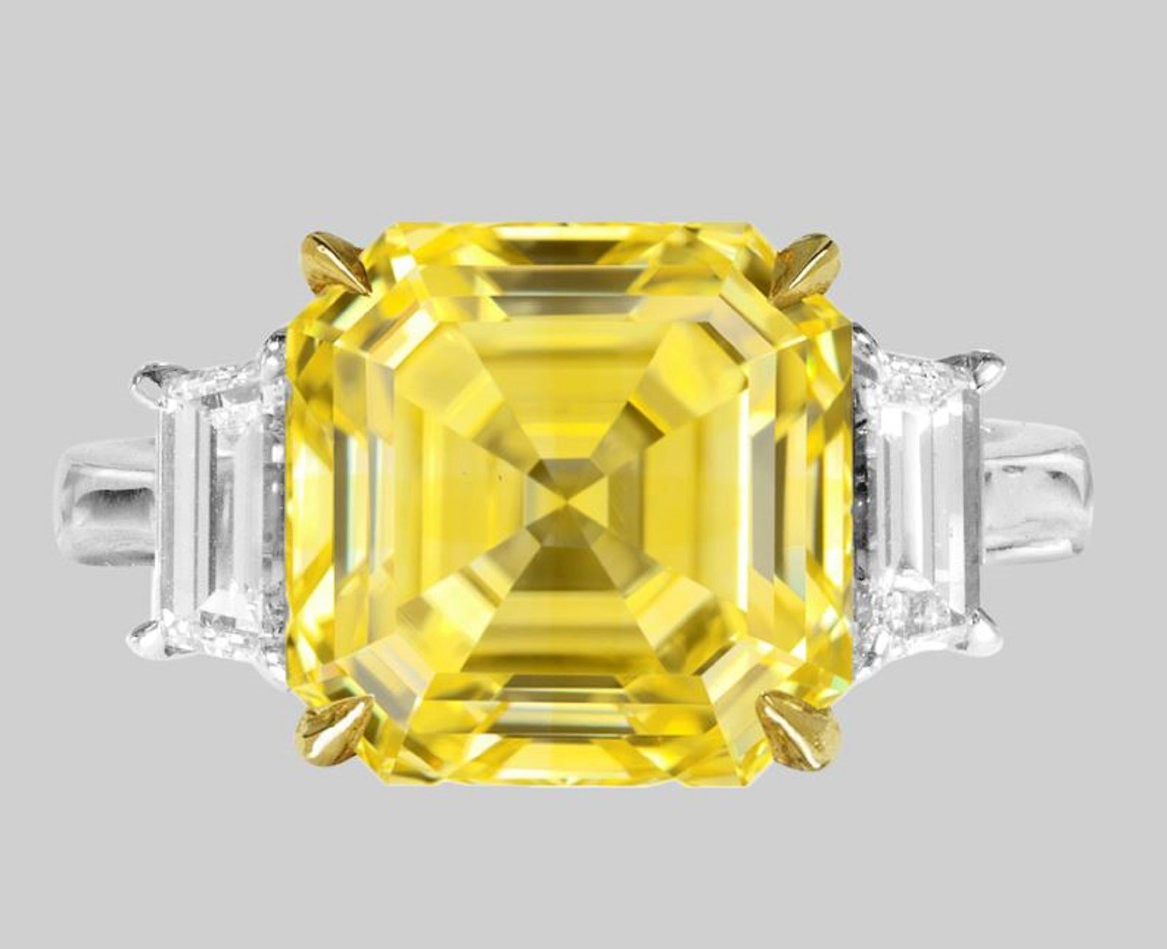 This exquisite ring is centered around a magnificent 3.50 ct Asscher-cut diamond, a true masterpiece of design and craftsmanship. The diamond, certified by the Gemological Institute of America (GIA), boasts a Fancy VIVID Yellow color, radiating a