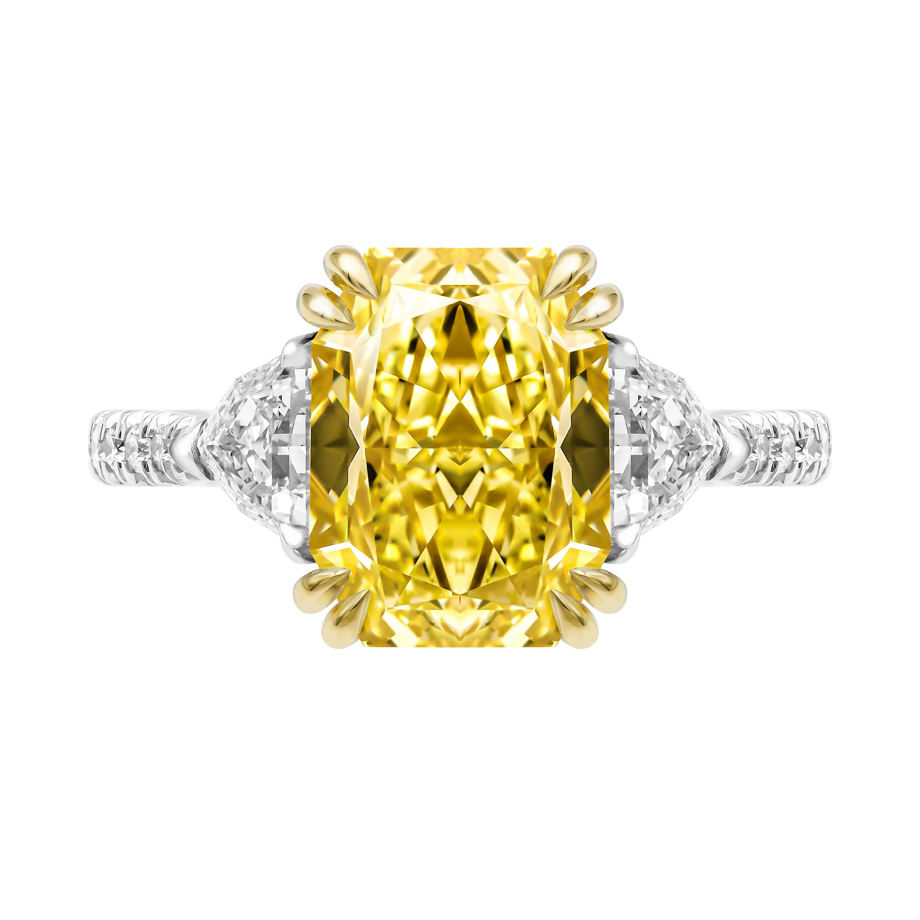 Extremely rare and one of a kind, a fancy color diamond is truly the most luxurious and exotic stone in diamond family. 
Very Vivid and Vibrant Huge 3.50ct Diamond is Natural Fancy Yellow Color, VVS2 clarity . 
Center measurements: 10.14 x 7.72 x