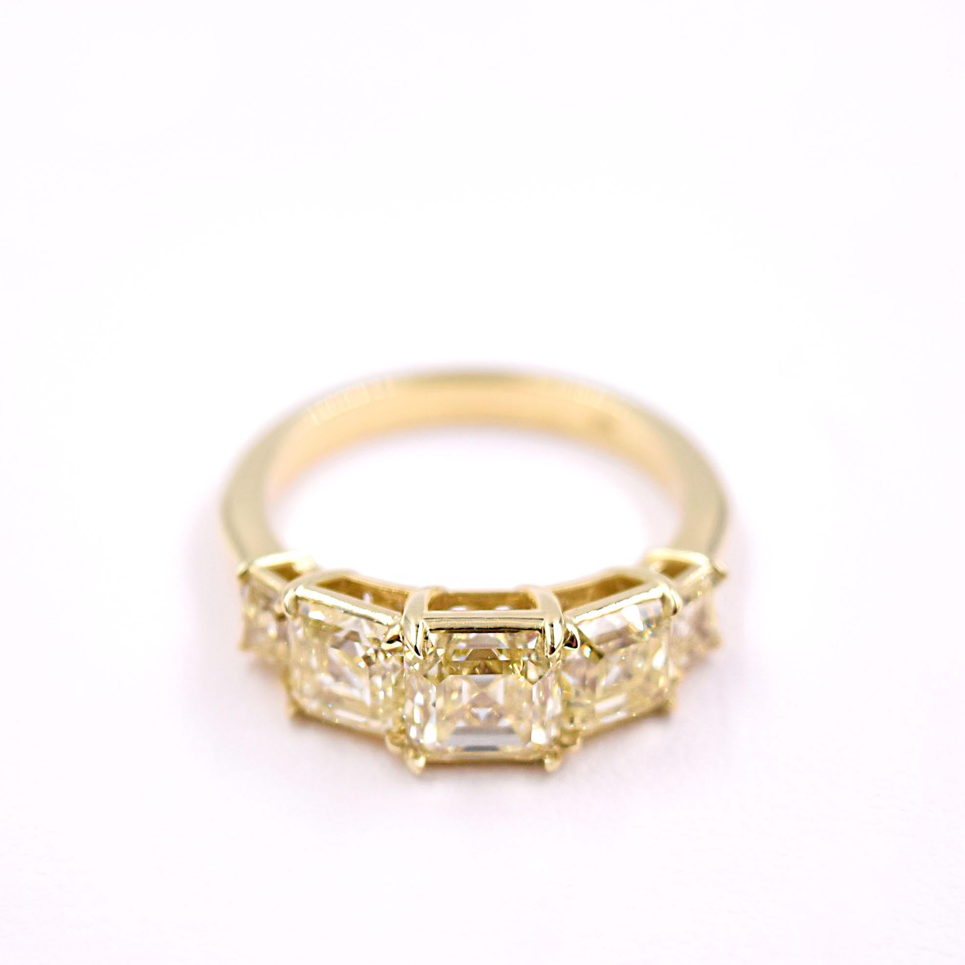 Fancy Light Yellow Diamond Band in Yellow Gold.
- GIA#6282372589 square emerald cut 1.54ct natural fancy light yellow VVS1 
- GIA#5286372314 square emerald cut 1.00ct natural fancy light yellow VS1
- GIA#6282372297 square emerald cut 1.00ct natural