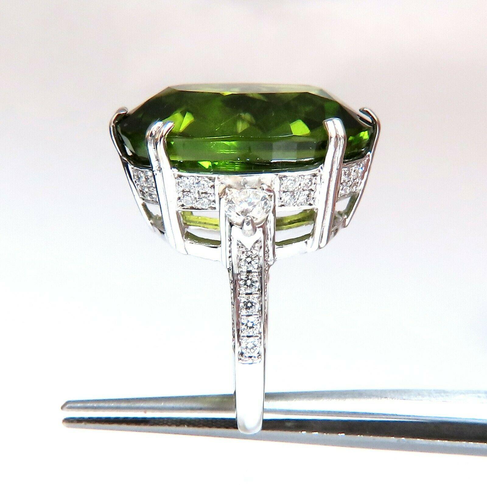 Oval Cut Peridot Classic Raised 

GIA Certified 33.97ct. Natural Peridot ring.

Oval cut, clean clarity & Transparent.

Classic Green Color

23.53 X 17.62 X 10.24mm

Report #2175627503



.56ct (2) Side natural round diamonds 

& 1.10ct Round